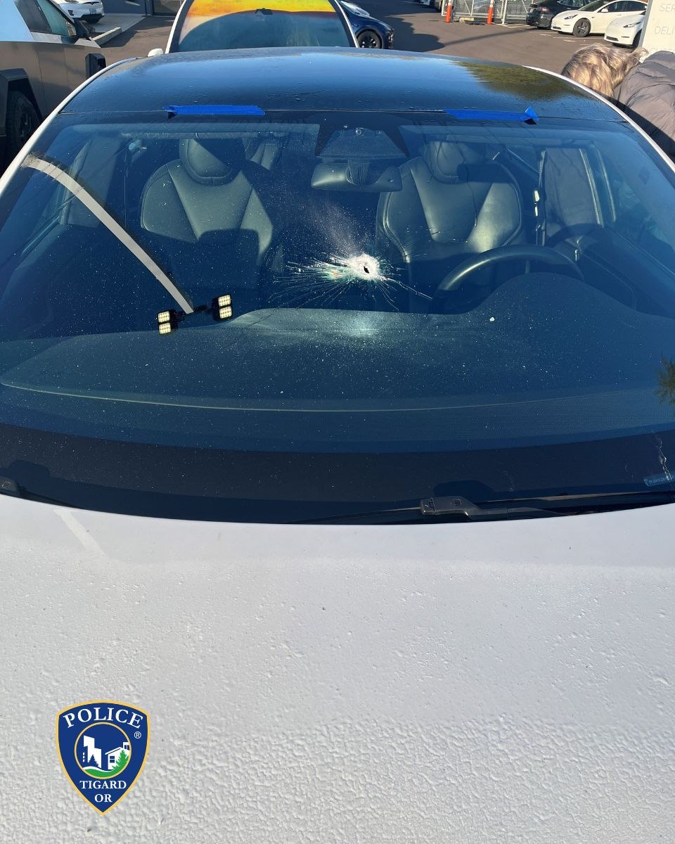 A bullet hole through a Tesla windshield at the dealership in Tigard. Photo / Tigard Police Department