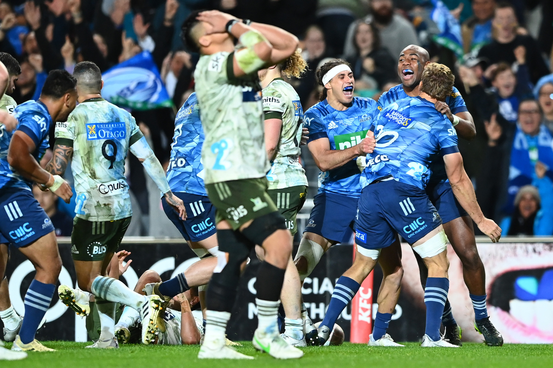 Blake Gibson and the Blues celebrate the match-sealing try in the win over the Highlanders. Photo / Getty