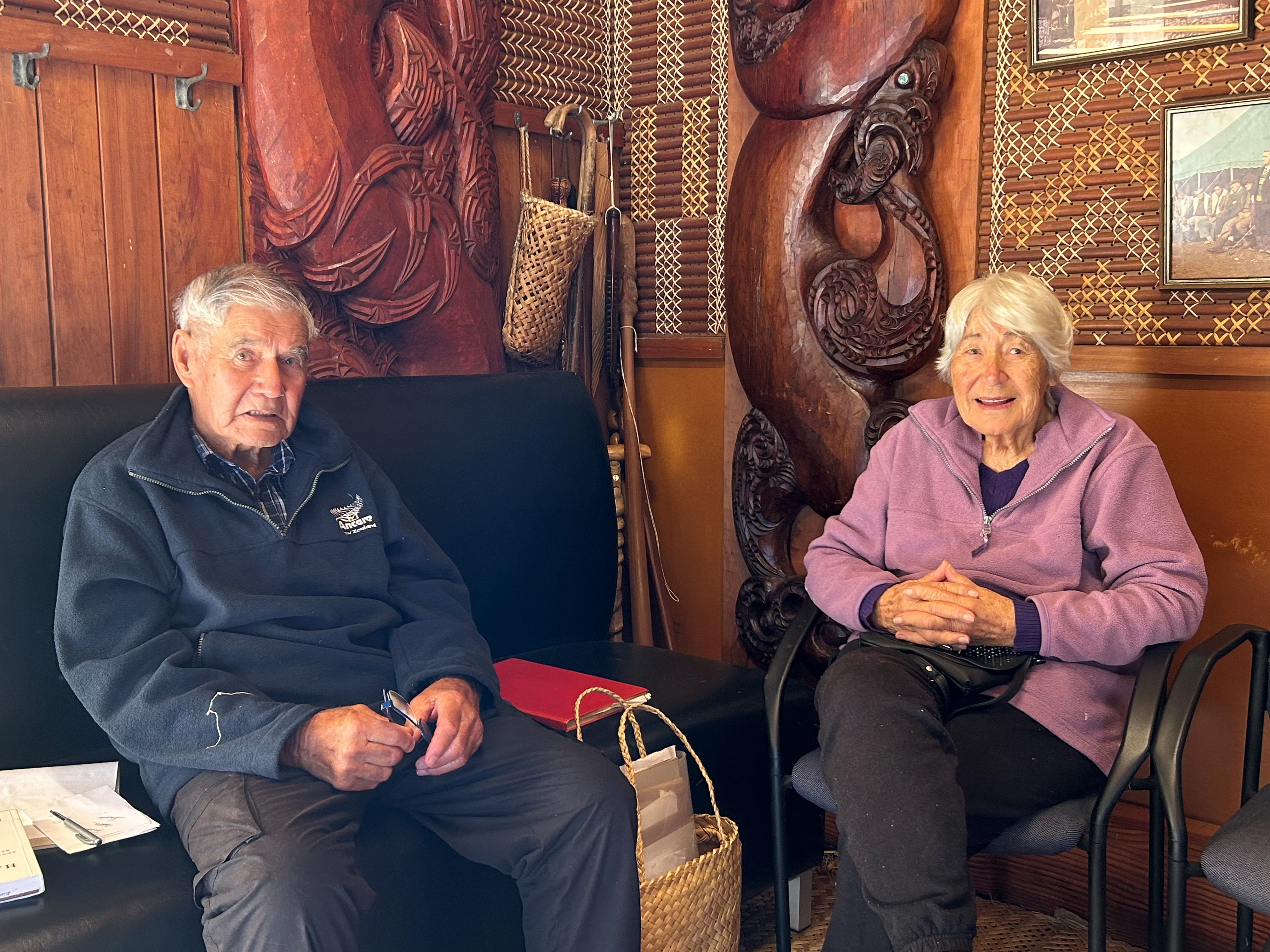 John Klaricich with wife Lila in the carved wharenui at Te Kai Waha. Photo / Harriet Brown