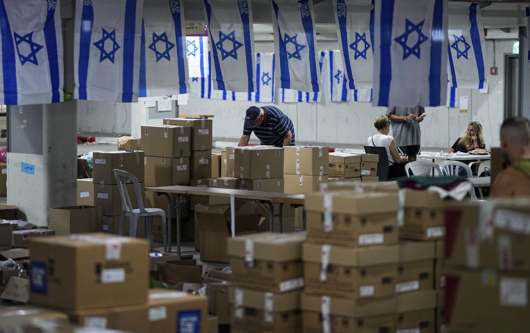 Workers at a donation centre to support Israeli soldiers and the 200,000 Israelis evacuated from their homes in the north and south during the Israel-Hamas war, at the headquarters of the Brothers in Arms aid organisation in Tel Aviv, Israel. Photo / AP