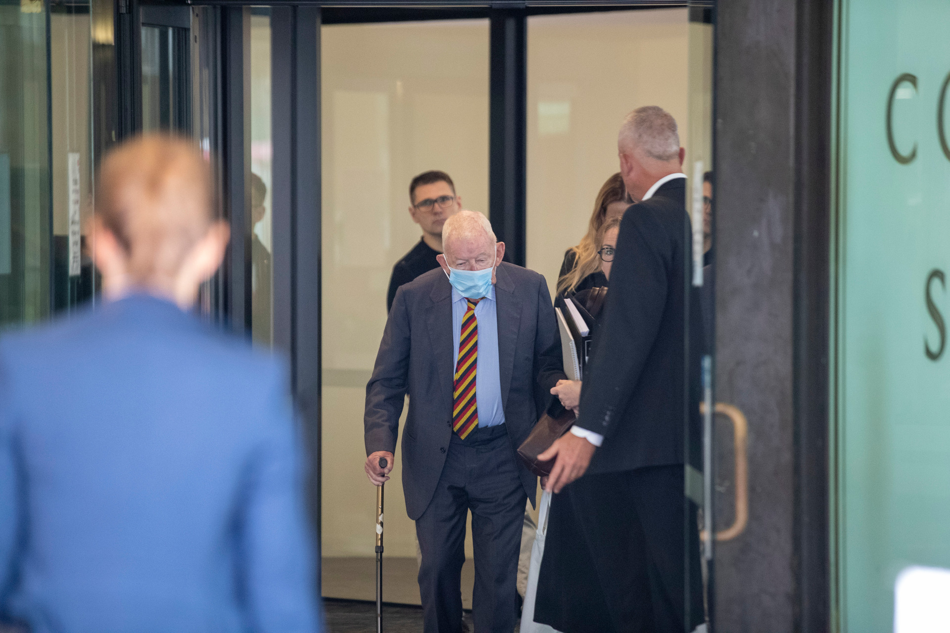 Sir Ron Brierley leaving a Sydney court after pleading guilty to possession of child sex abuse material. Photo / Liam Mendes