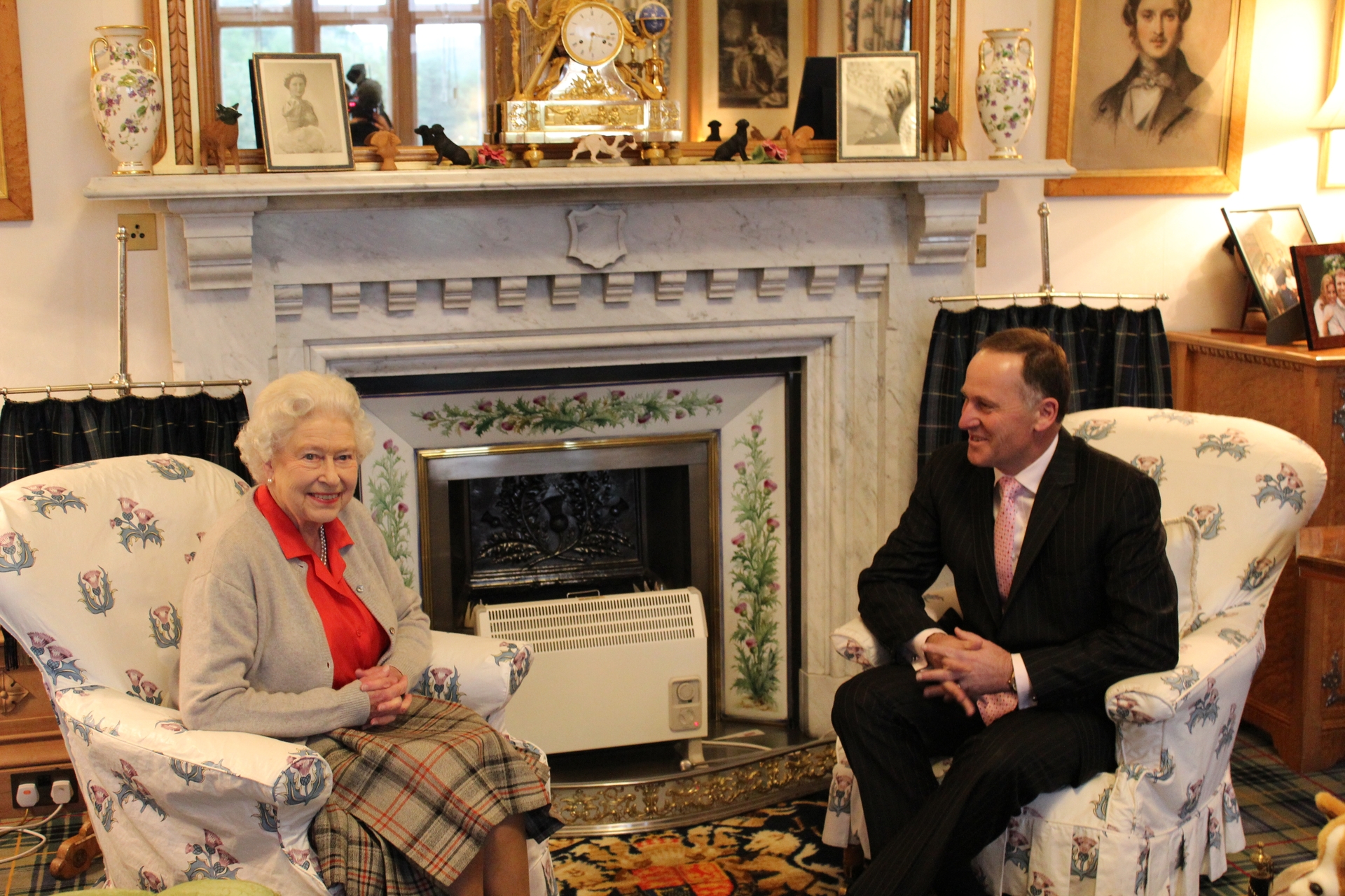 Queen Elizabeth II talks to then PM Sir John Key at Balmoral Castle in 2013. Photo / Claire Trevett