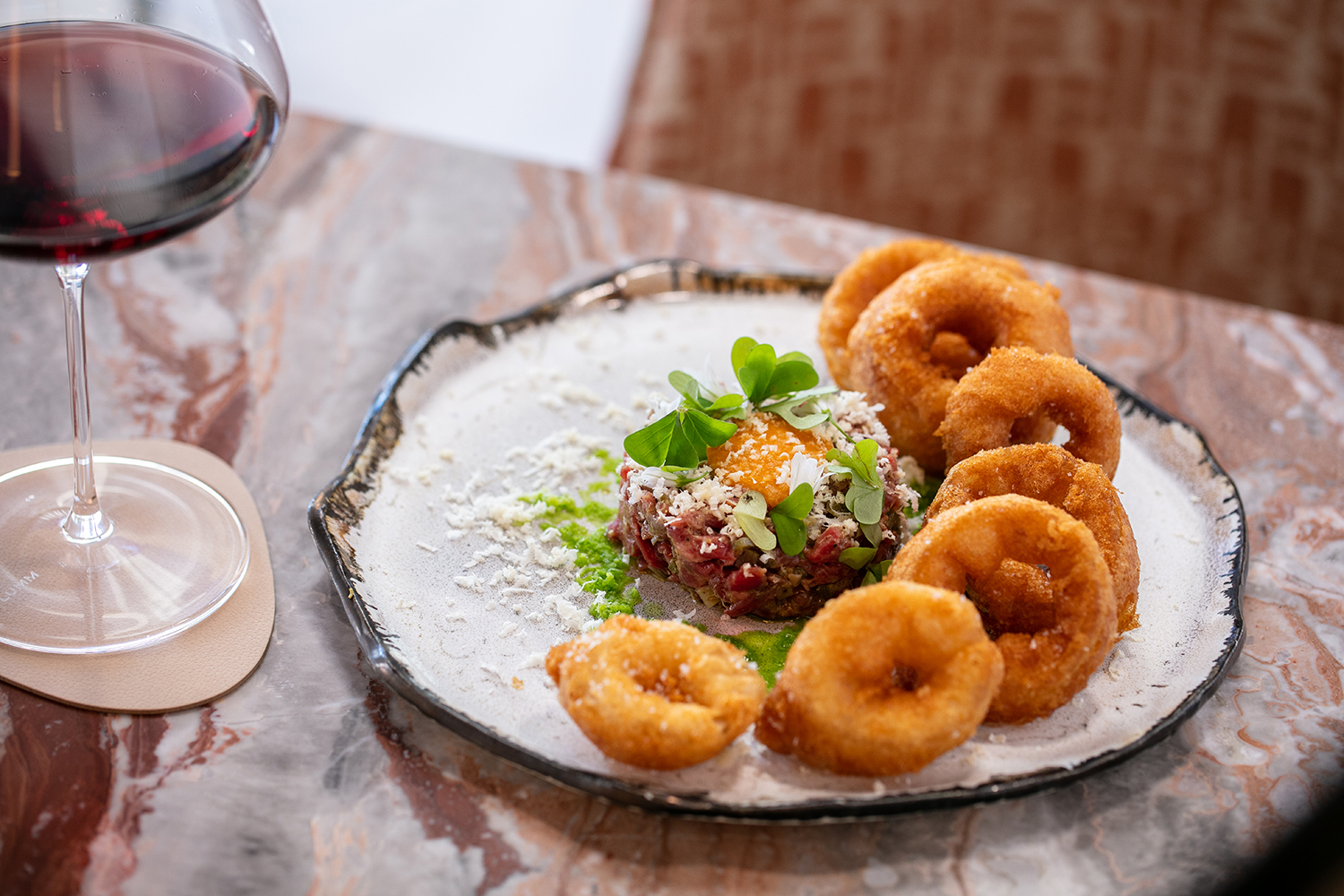 The beef tartare with onion rings. Photo / Babiche Martens