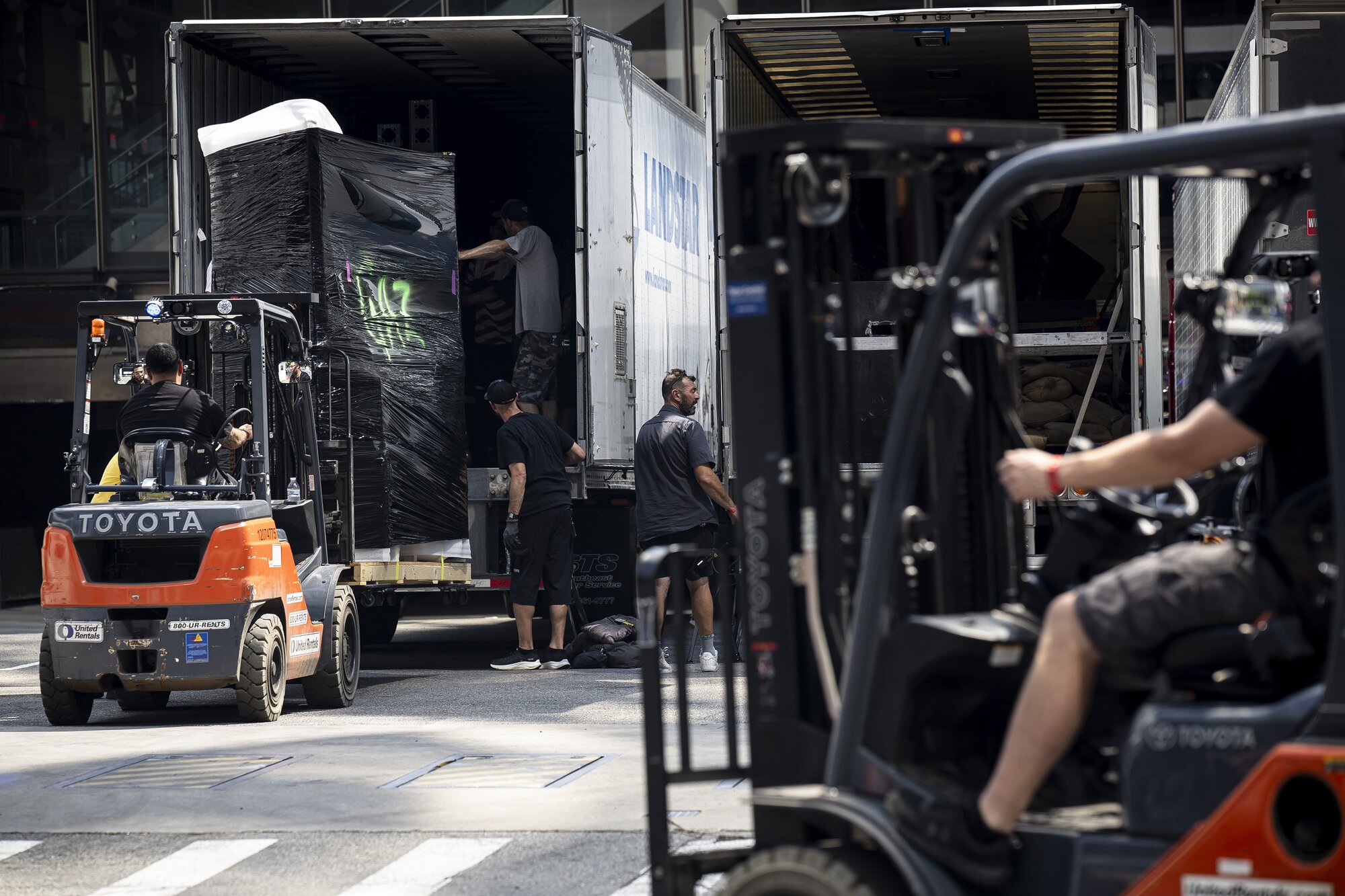 Forklifts unloaded large, plastic-wrapped cargo outside Madison Square Garden in Manhattan on Wednesday, a glimpse of the extensive logistics behind Taylor Swift and Travis Kelce’s wedding celebration. Photo / Dave Sanders, The New York Times