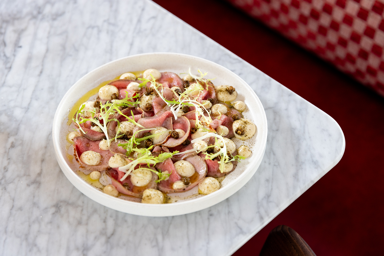 The vitello tonnato (cold, sliced veal with a mayonnaise-like sauce). Photo / Babiche Martens