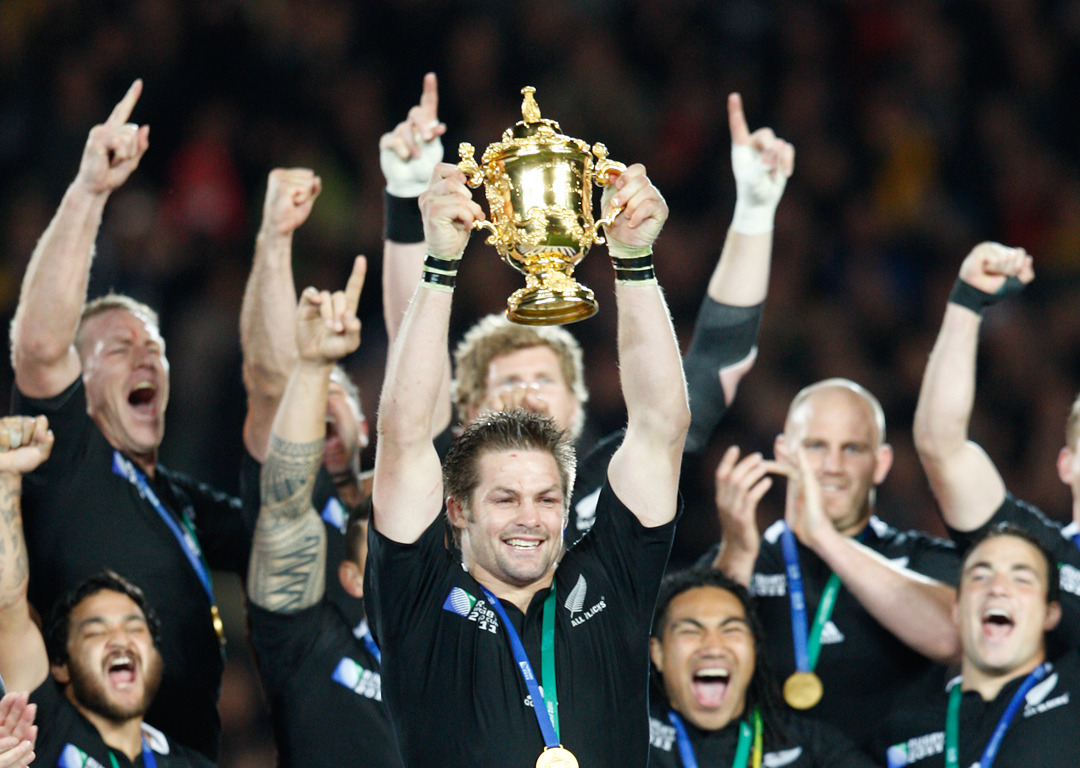 Richie McCaw lifts the Rugby World Cup trophy after the 2011 final. 