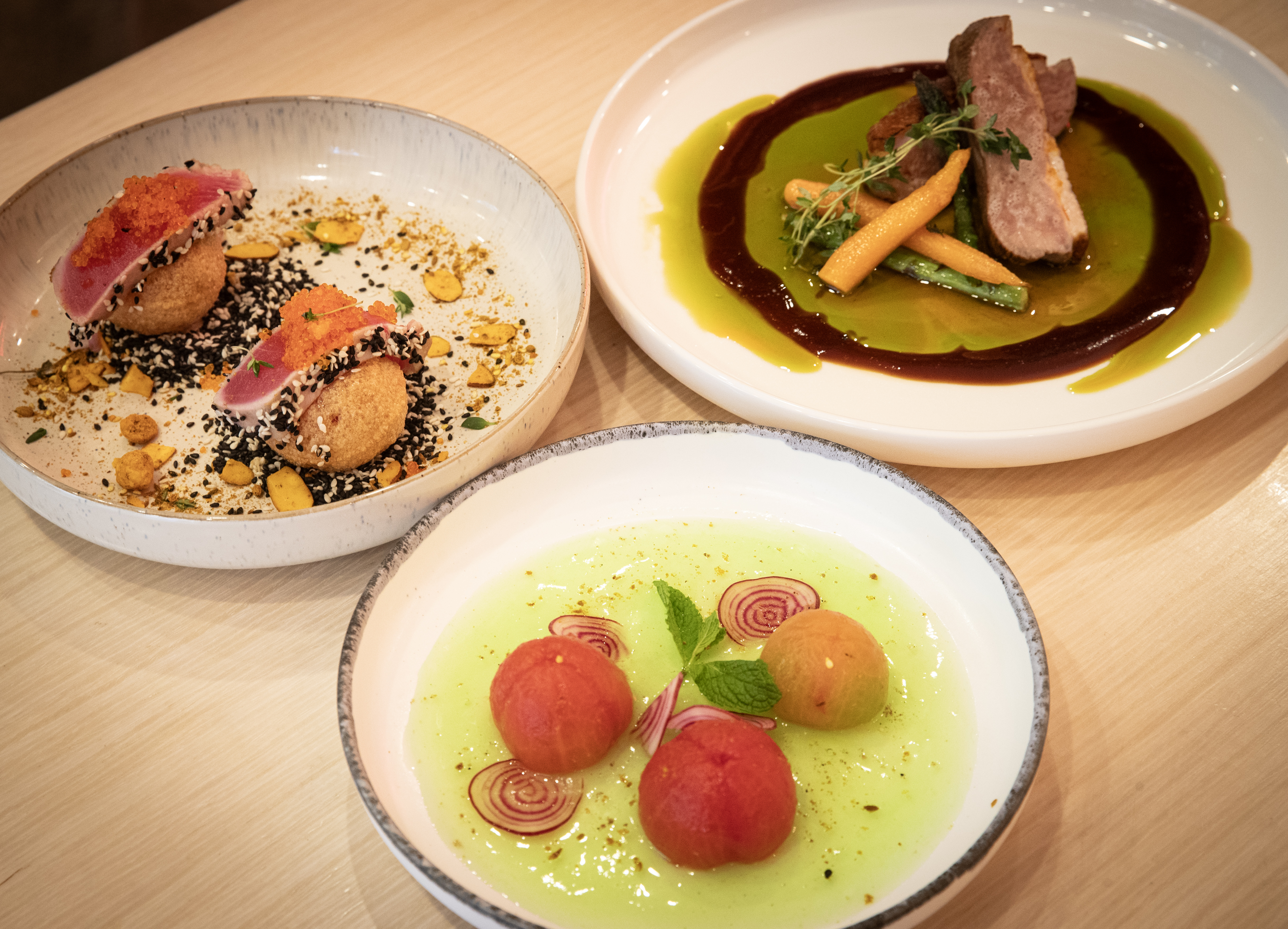Xie Xie’s tomato salad, tuna tartare and barbecue duck breast. Photo / Jason Oxenham