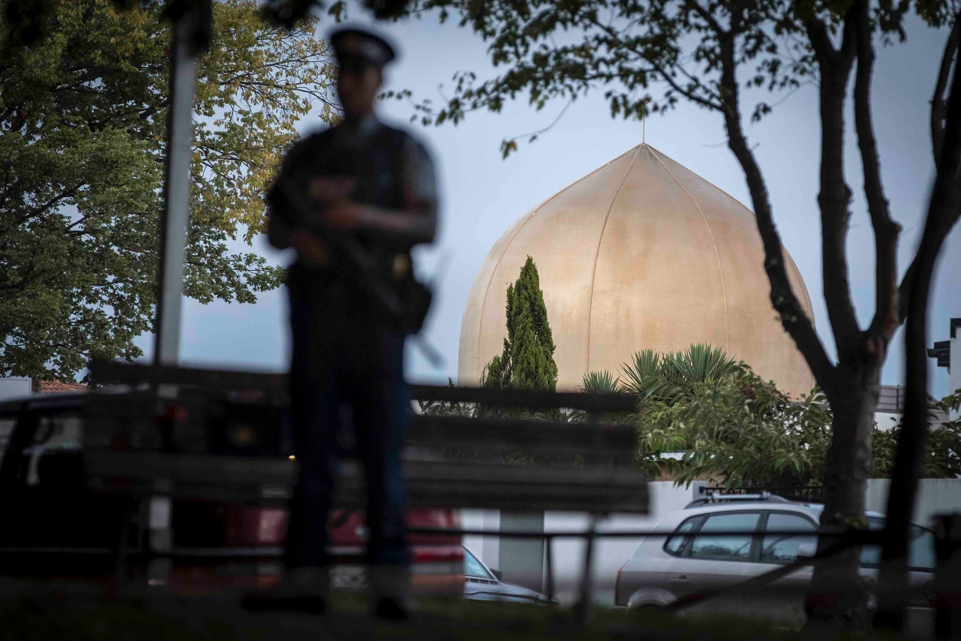 An armed police officer guards Masjid Al Noor in the days after the March 15 attack. Photo / File