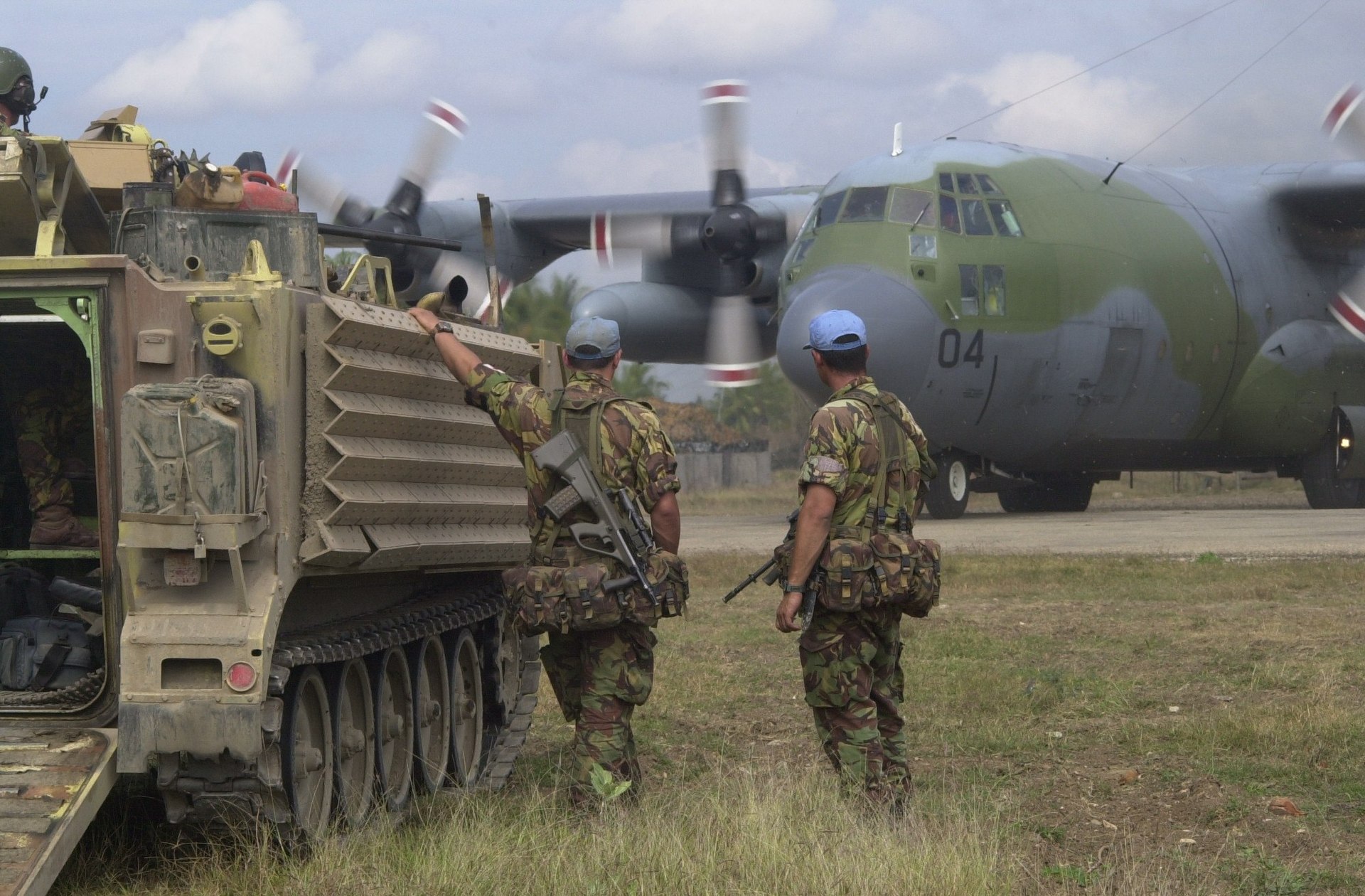 New Zealand Army soldiers next to a M113 armoured personnel carrier at Suai Airport. Photo / File