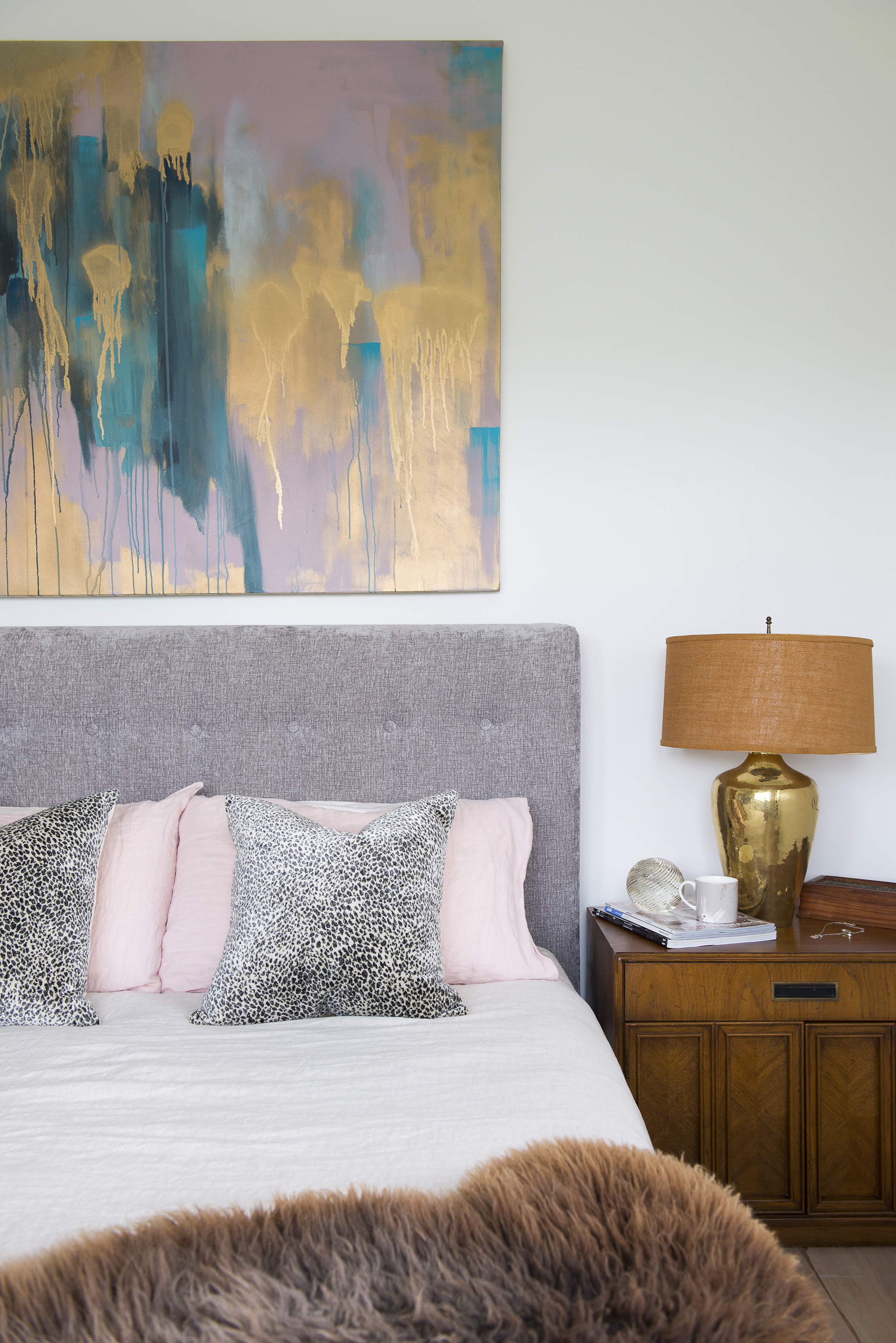 Hang your favourite artwork above the bed. Photo / Cave Bureau