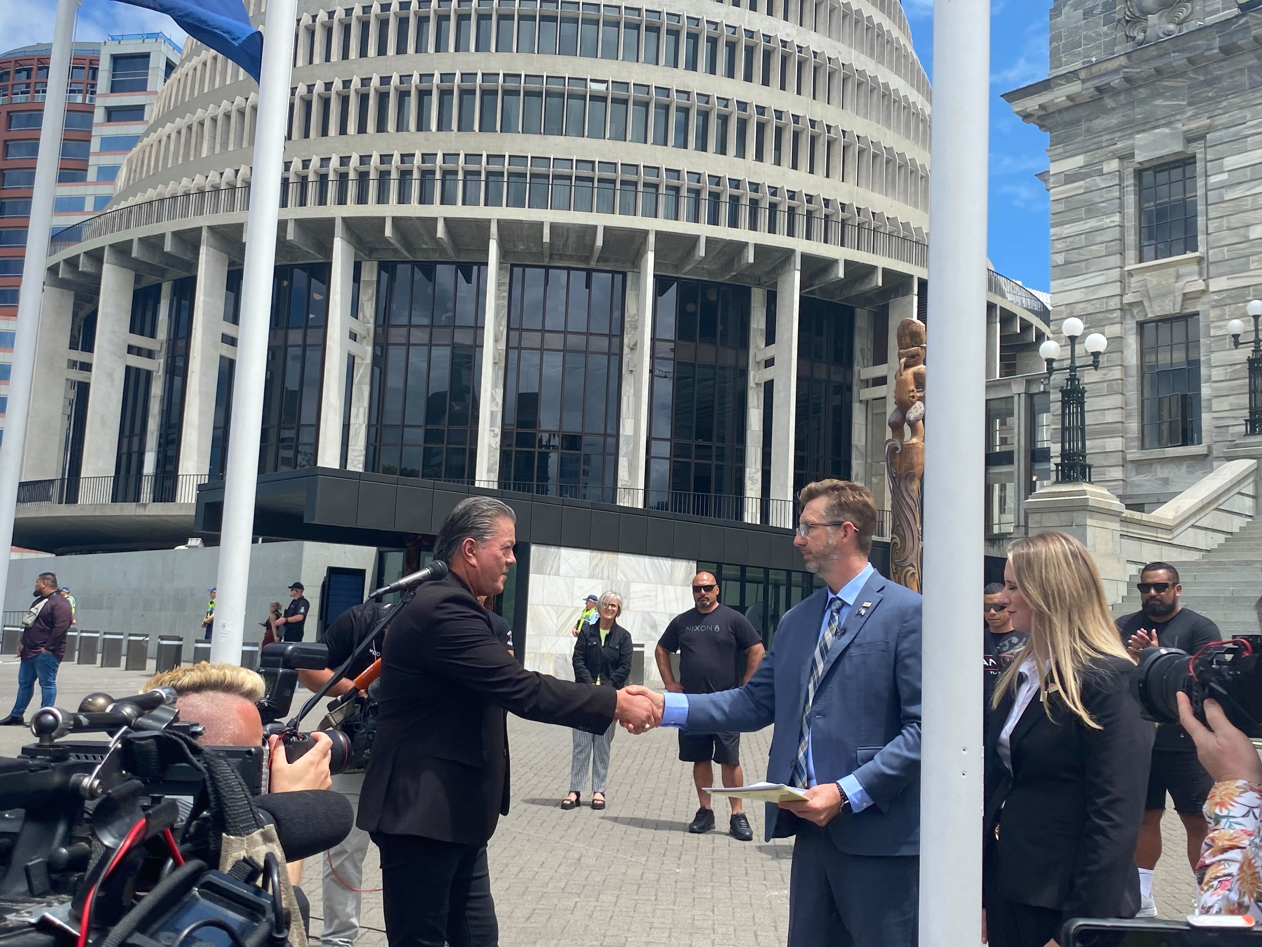 Act MP Simon Court accepts the petition from Brian Tamaki in front of Parliament. Photo / Vita Molyneux