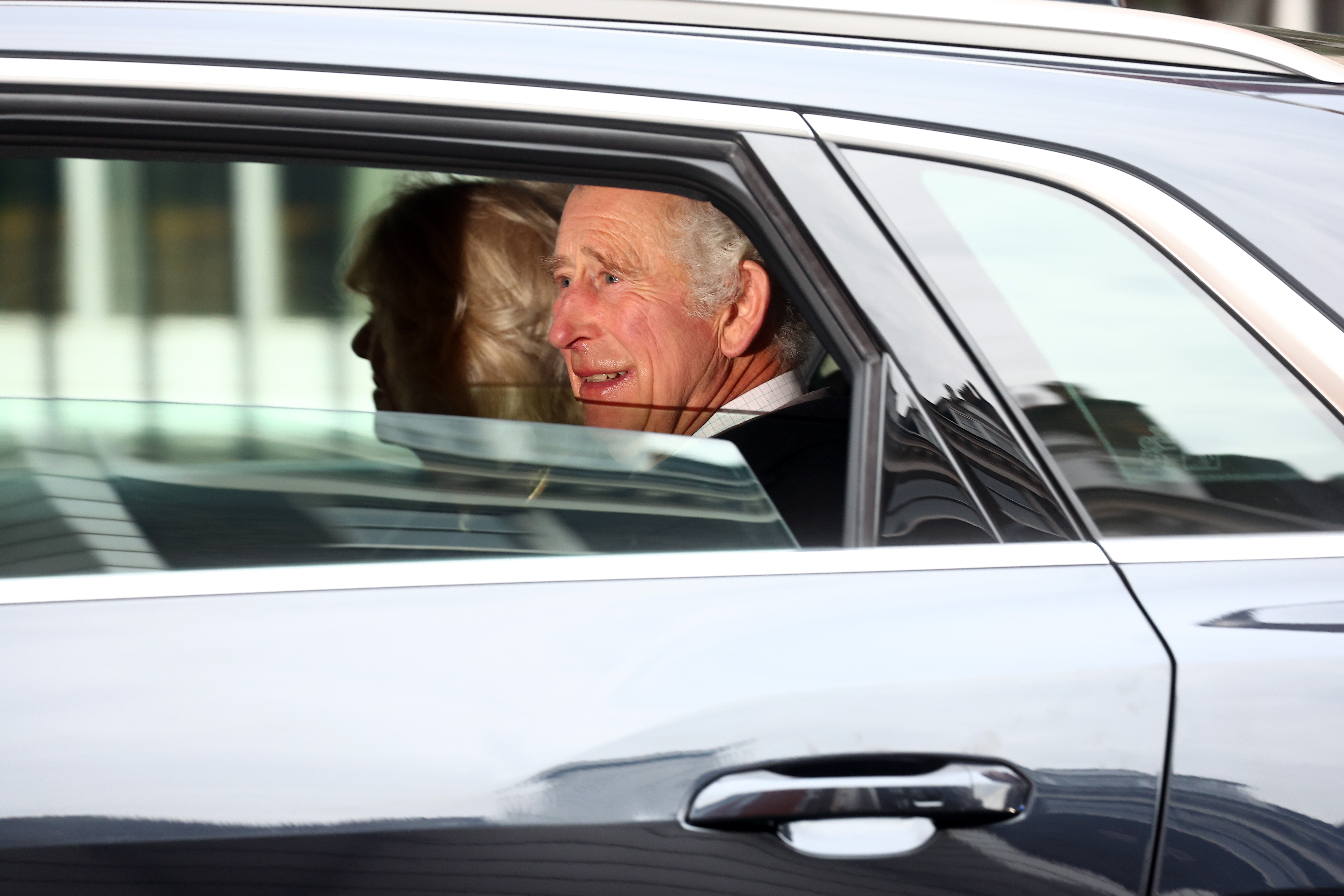 The King smiles at well-wishers as he leaves the London Clinic after treatment. Photo / Getty Images