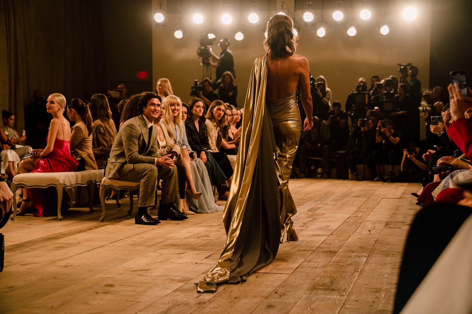 The 90s supermodel Christy Turlington closes the Ralph Lauren fashion show in a disco-cowboy gold lamé gown in New York. Photo / Jane Kim, The New York Times