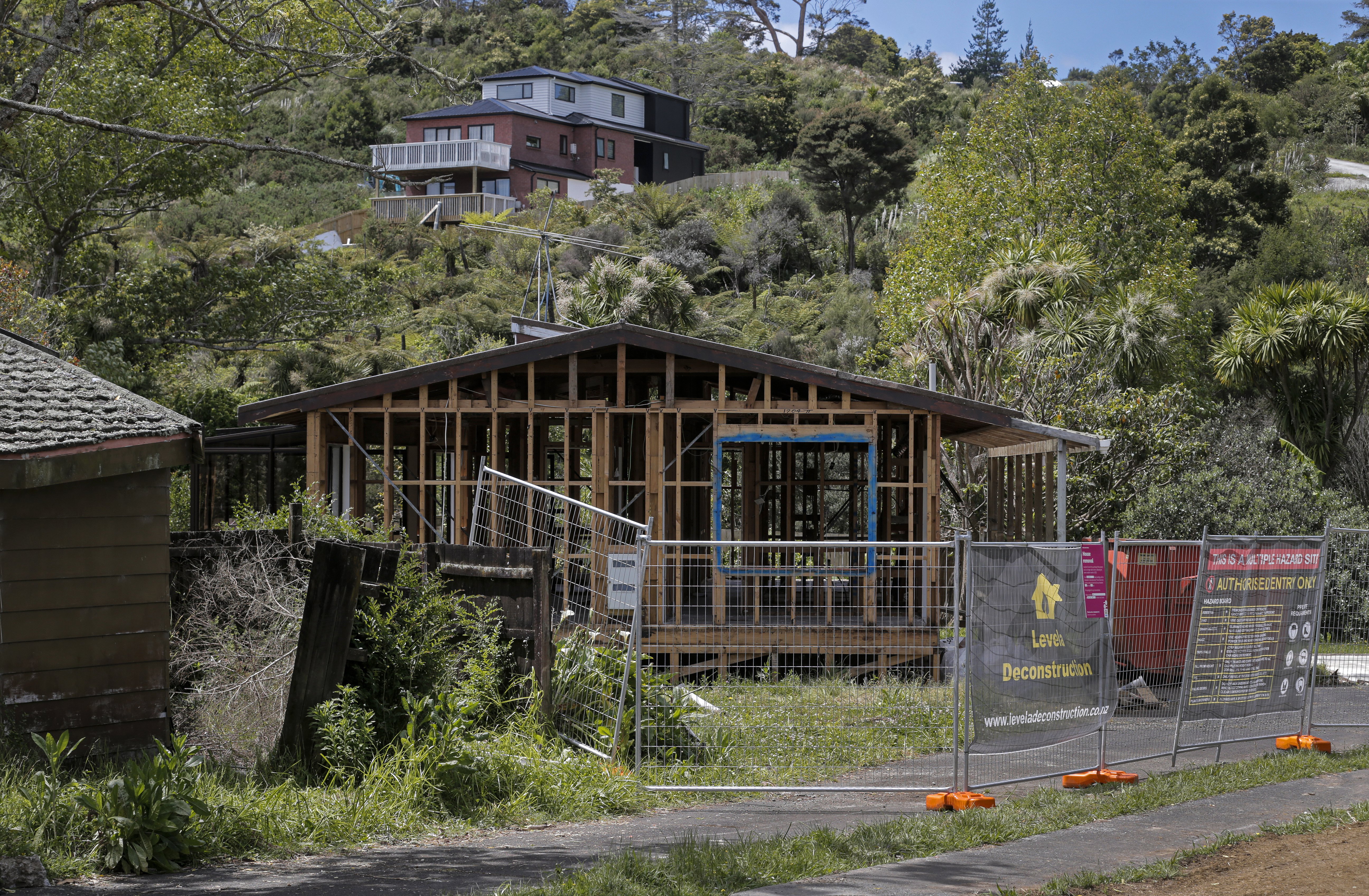 A house in Camphora Place is taken apart for materials to be recycled. Photo / Alex Burton