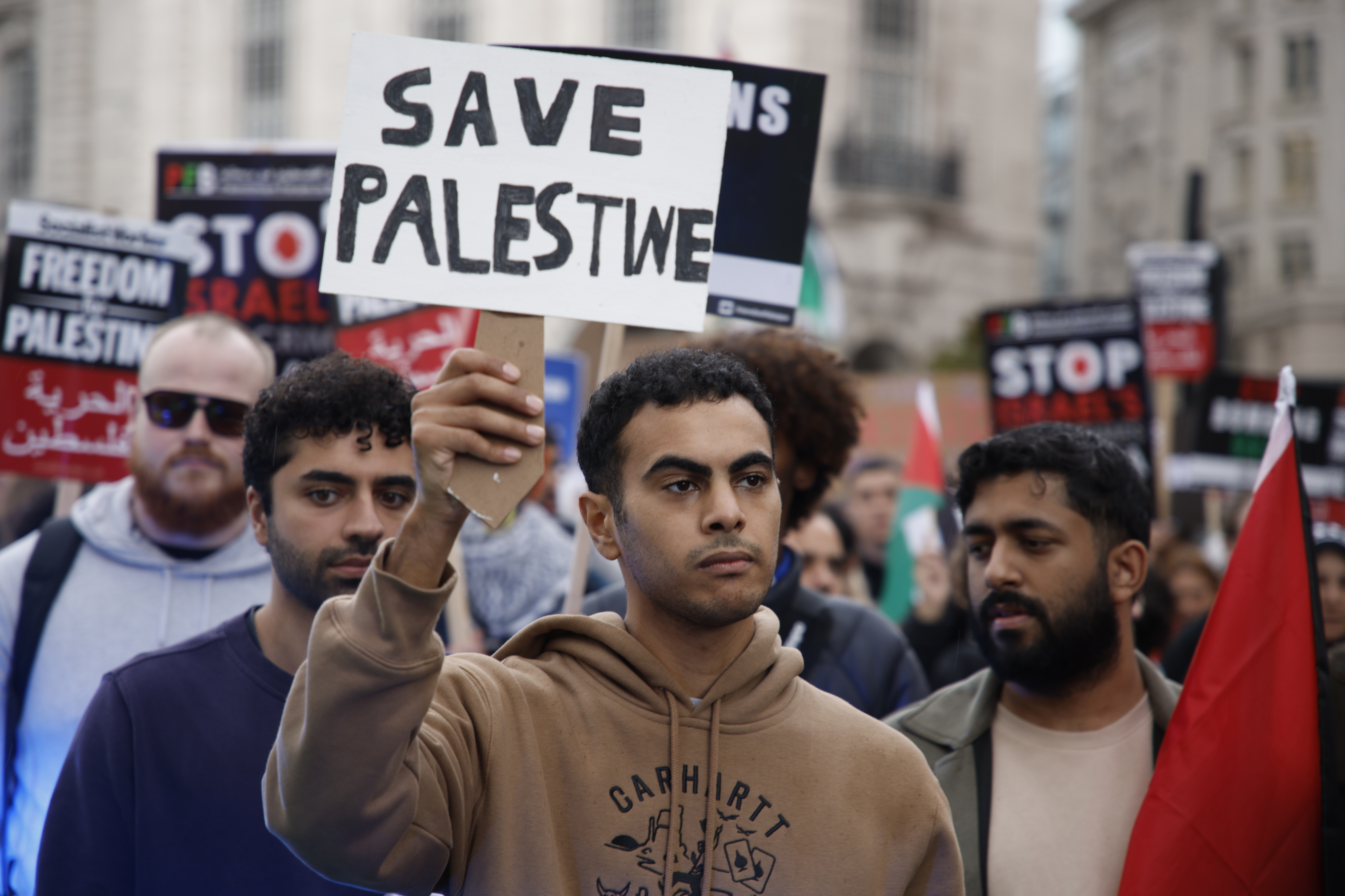 Demonstrators hold up flags and placards during a pro-Palestinian demonstration in London. Photo / AP