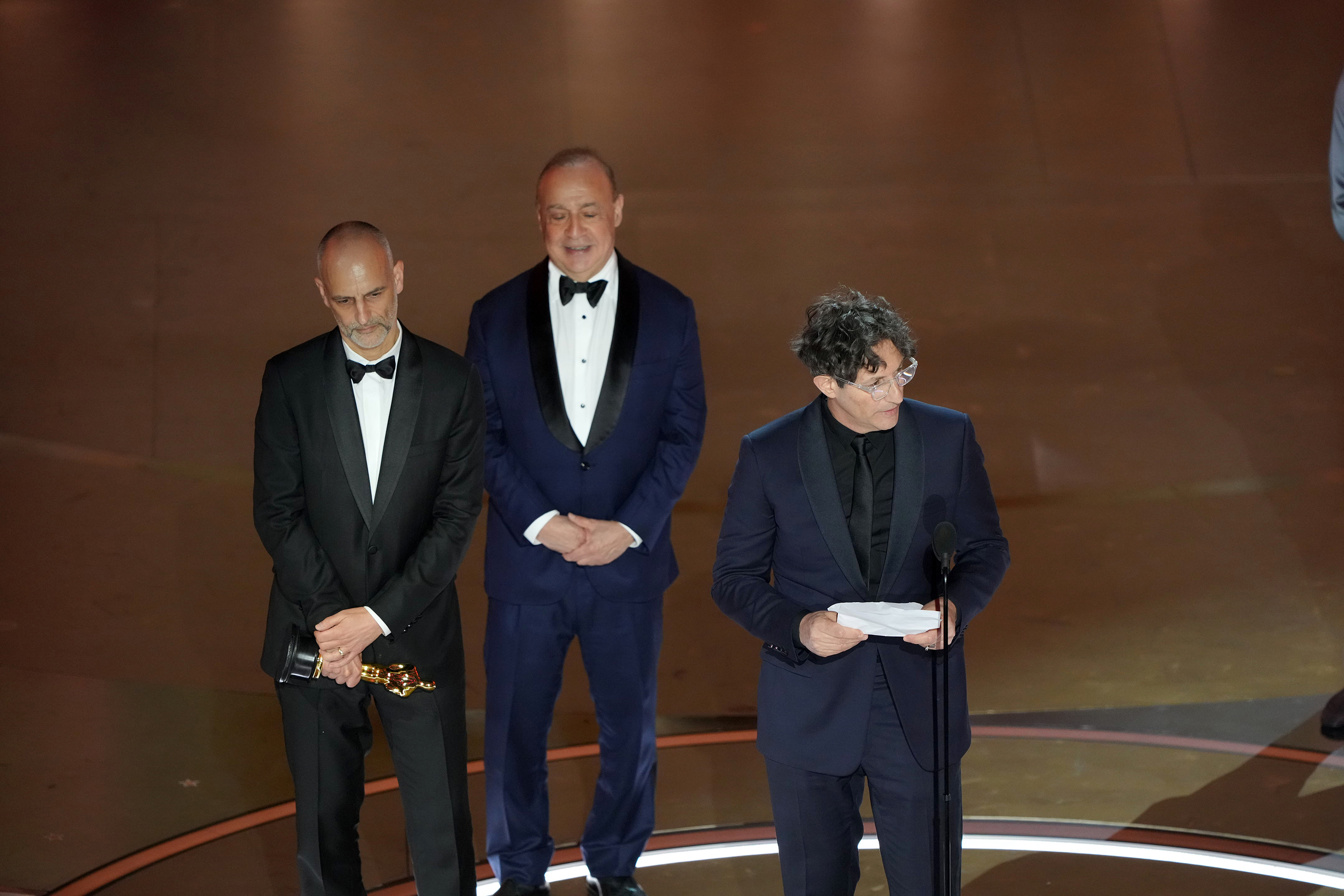 Jonathan Glazer, with fellow Zone of Interest filmmakers behind him, accepts the award for best international feature. Photo / Amir Hamja, The New York Times