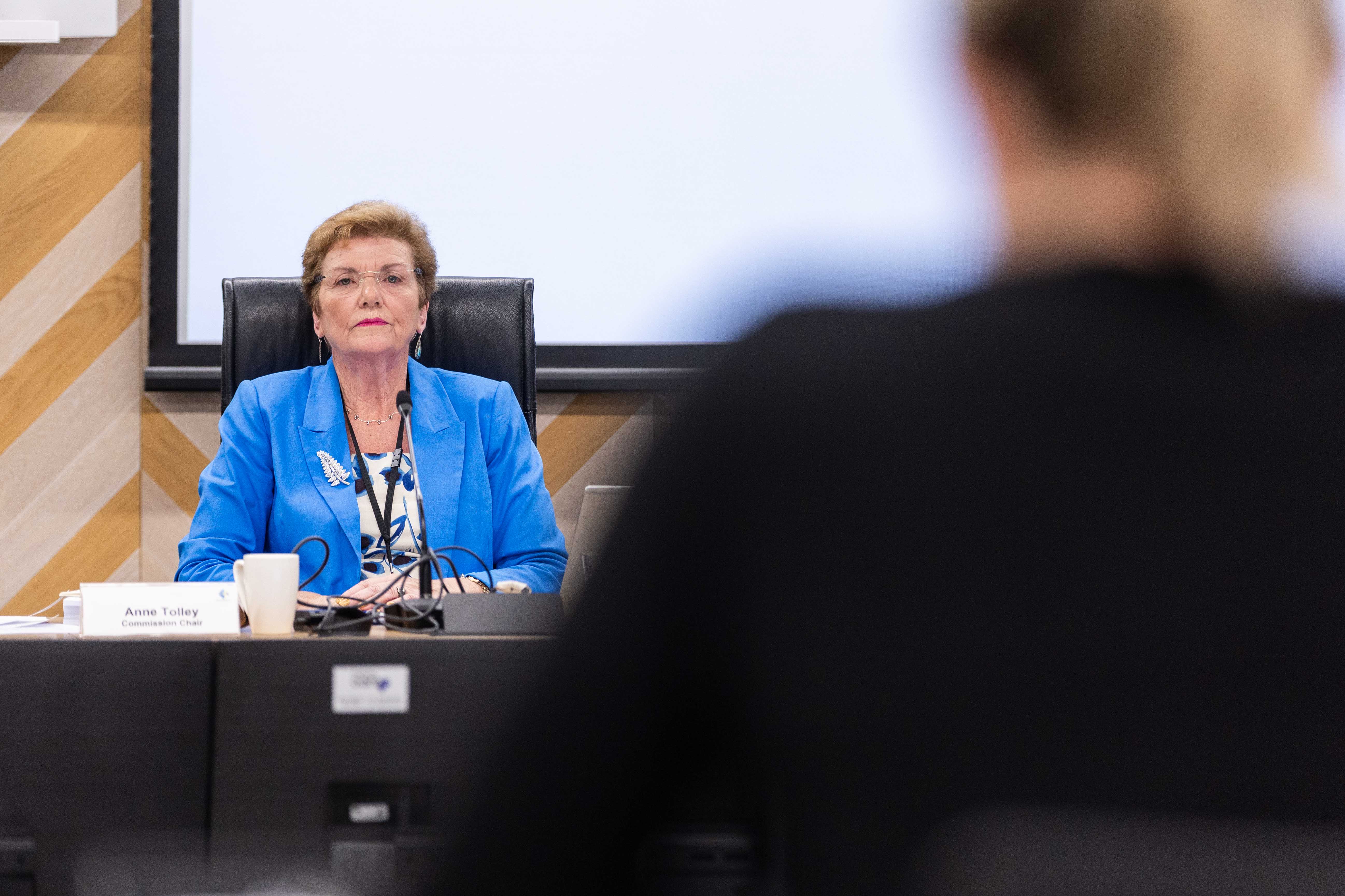 Anne Tolley, commissioner chair of the Tauranga City Council, listens as Ash Gee presents a petition. Photo / Alex Cairns