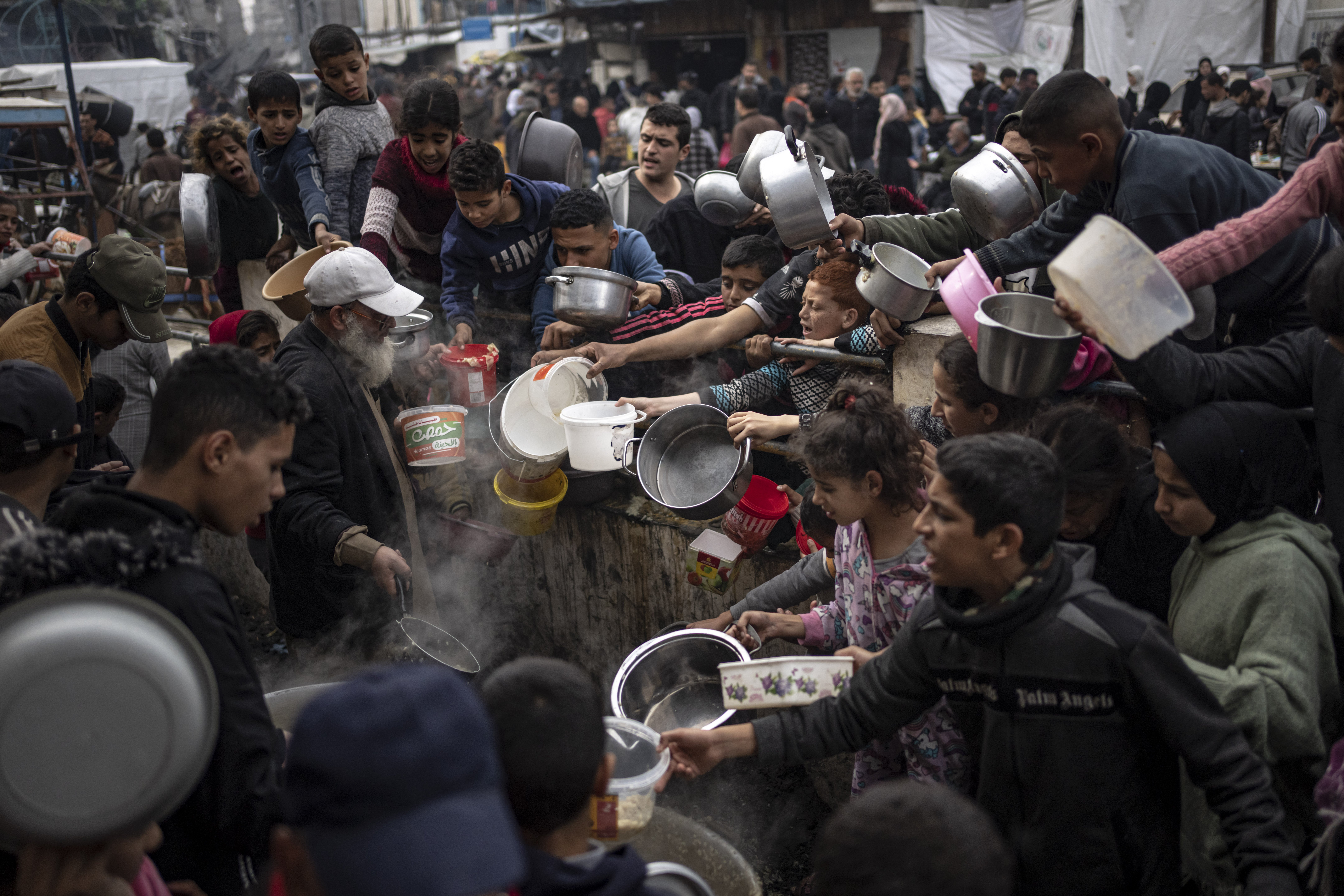 Palestinians line up for meals in Rafah, Gaza Strip. Photo / AP