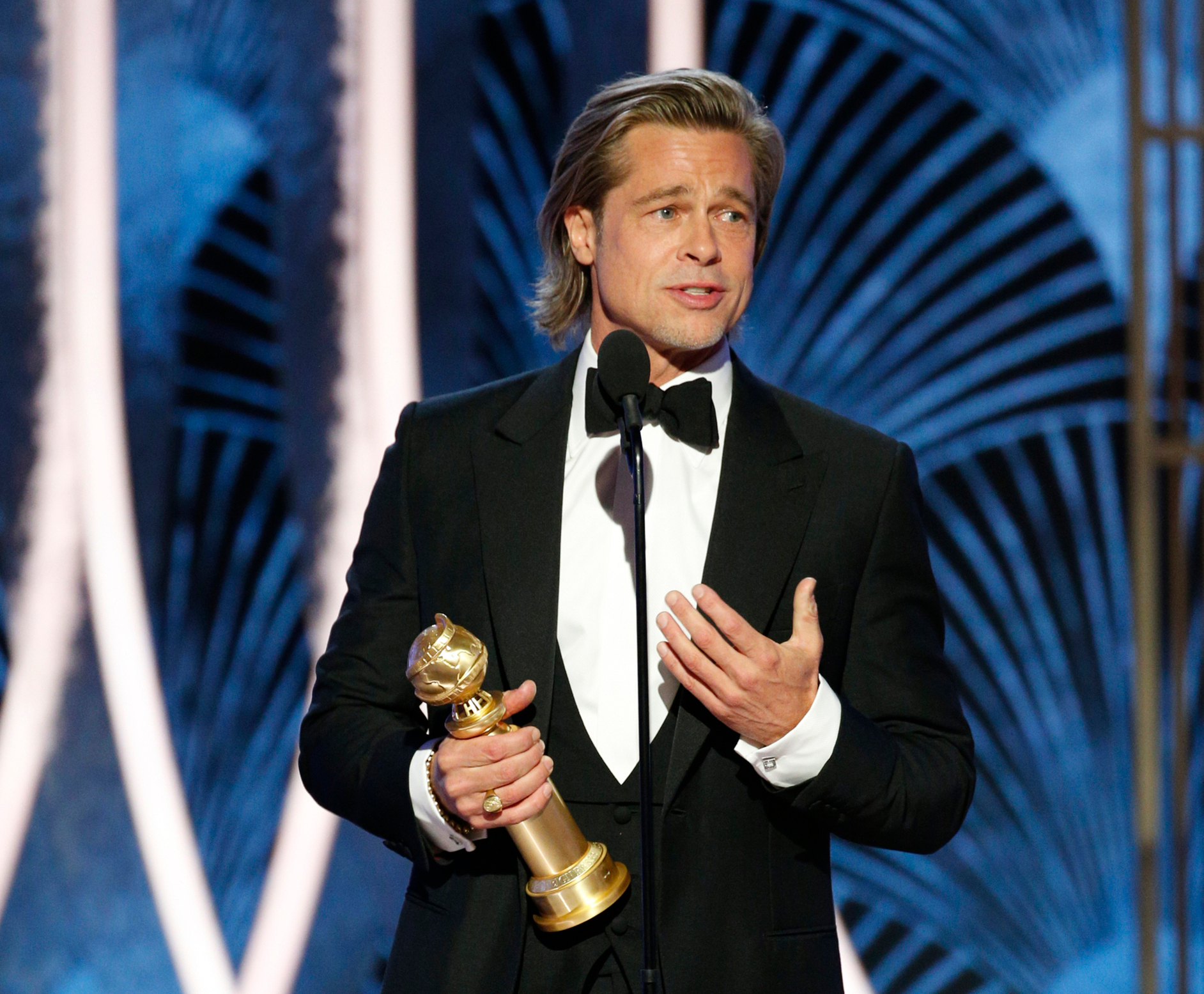 Brad Pitt accepting the award for best supporting actor in a film. Photo / AP.
