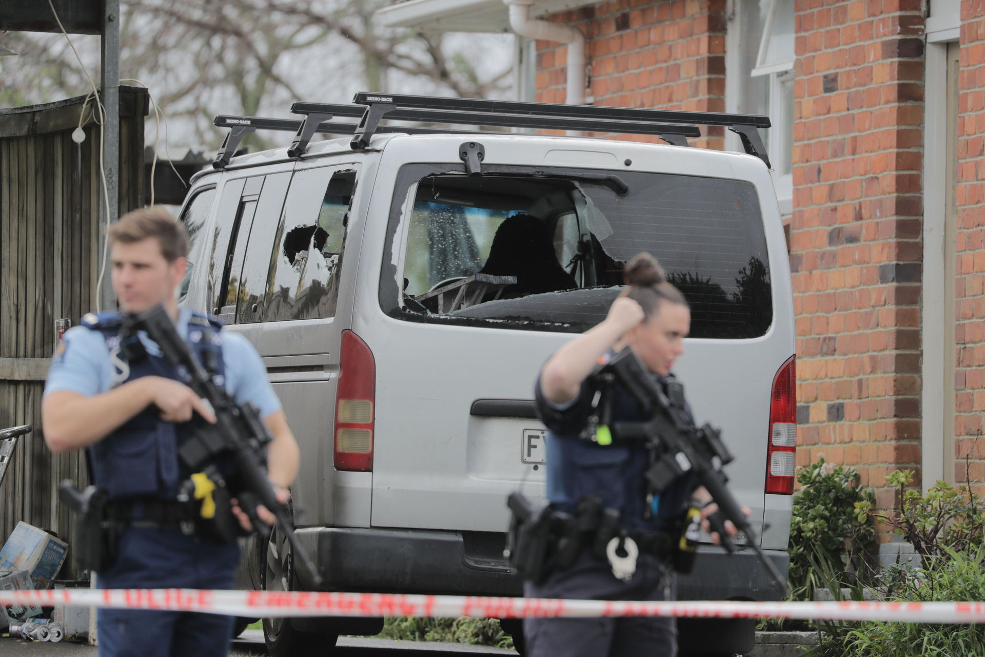 Armed police stand guard outside a Glen Innes home after a shooting on July 19, 2022. Father and son Texas and Wiremu Doctor, both patched Rebels members, have been sent to prison for the shooting. Photo / Michael Craig