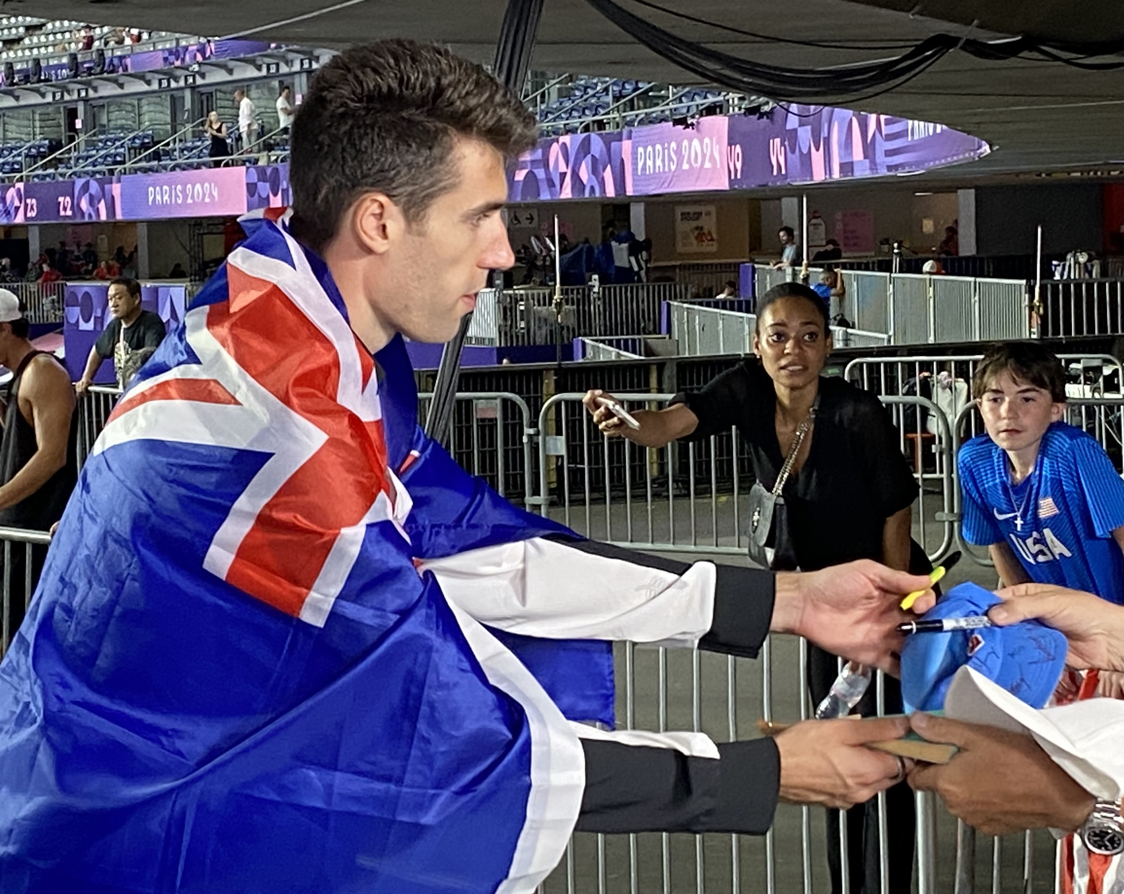 Gold medallist Hamish Kerr signs autographs for young fans after his event. Photo: Michael Burgess/NZH