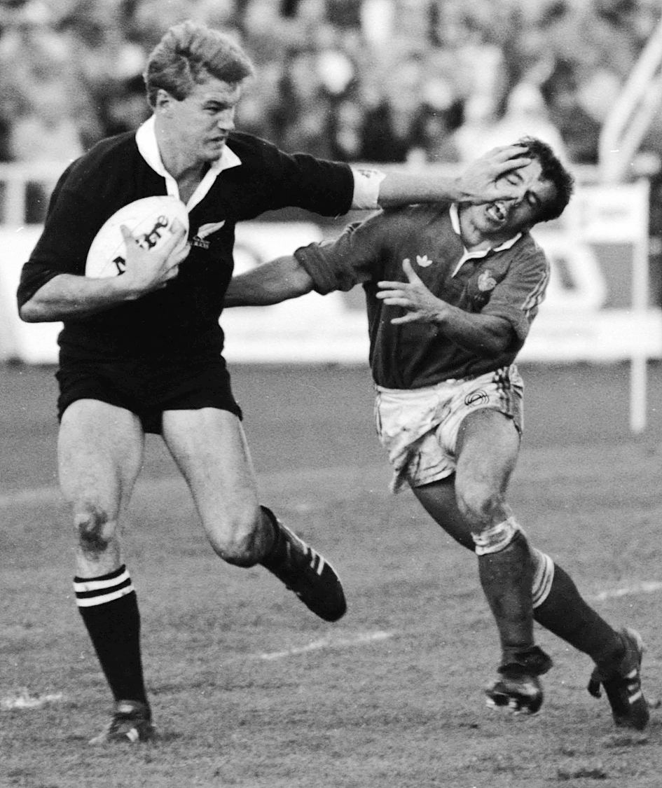 John Kirwan fends off the French attack in the 1987 Rugby World Cup final at Eden Park. Photo / John Stone