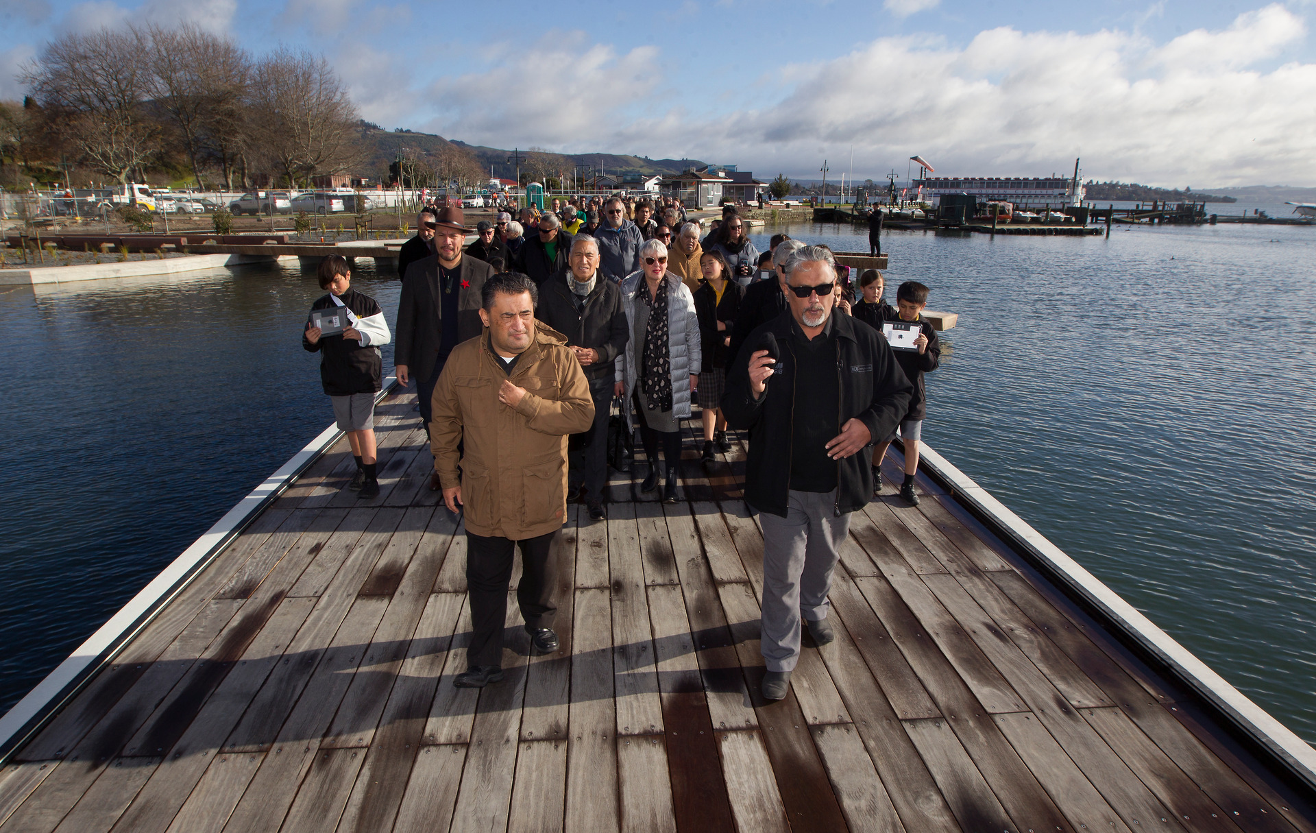 Ngāti Whakaue representatives Bryce Murray and Kingi Biddle led the procession along the boardwalk as Murray recited karakia. Photo / Ben Fraser