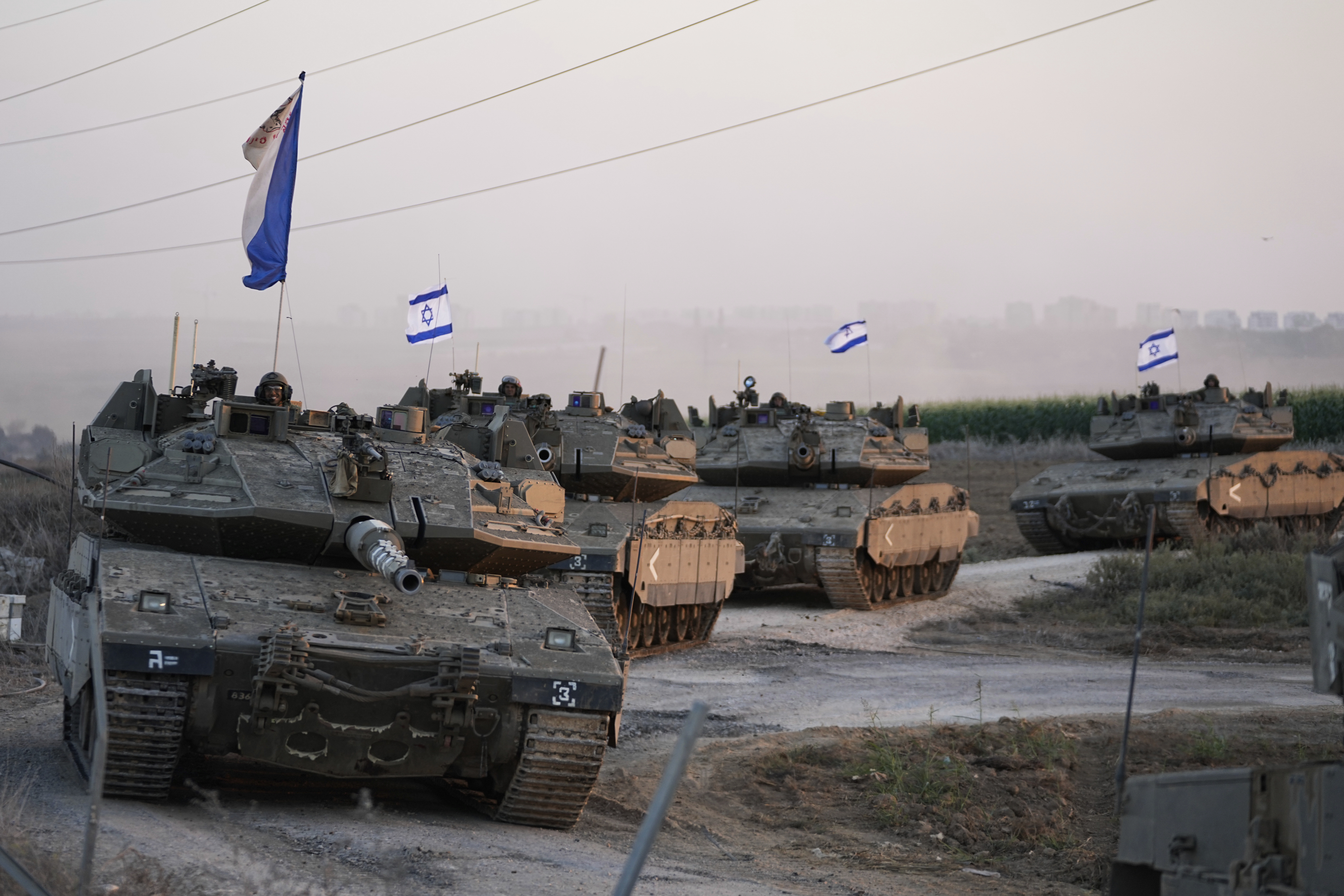 Israeli tanks head towards the Gaza Strip border in southern Israel. Photo / AP