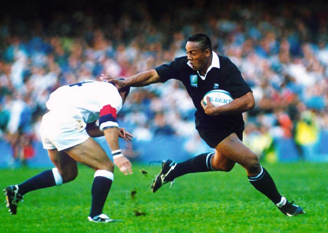 Jonah Lomu fends off Tony Underwood in the 1995 Rugby World Cup semifinal. Photosport