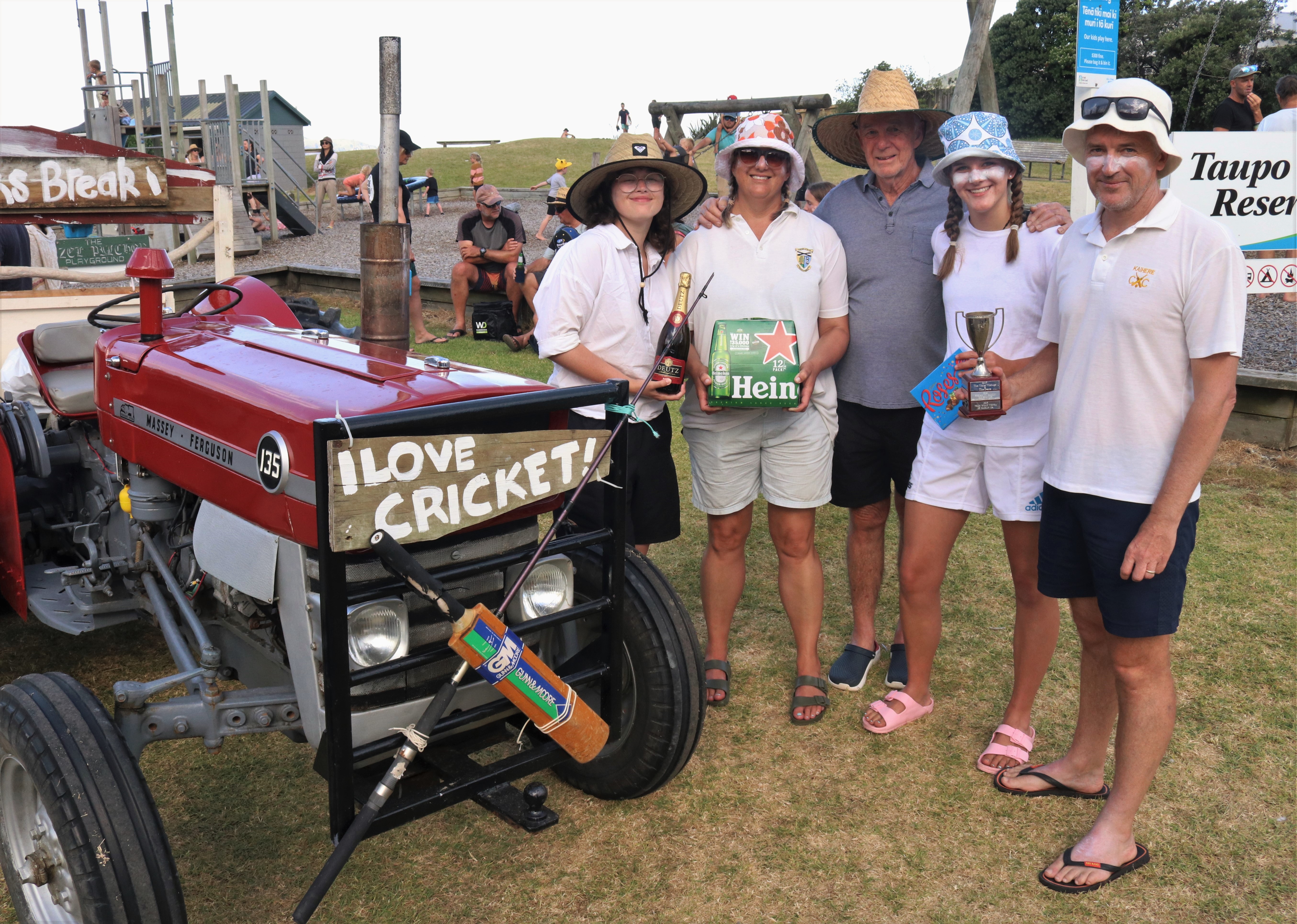 Taupō Bay Cricket Club won the supreme trophy for the most-loved tractor, a Massey Ferguson 135 from 1962. (From left): Emma Stein, Andrea Williams, tractor owner Clive Pomfrett, Grace Williams and Simon Williams, of Pukekohe/Taupō Bay. Photo / Peter de Graaf