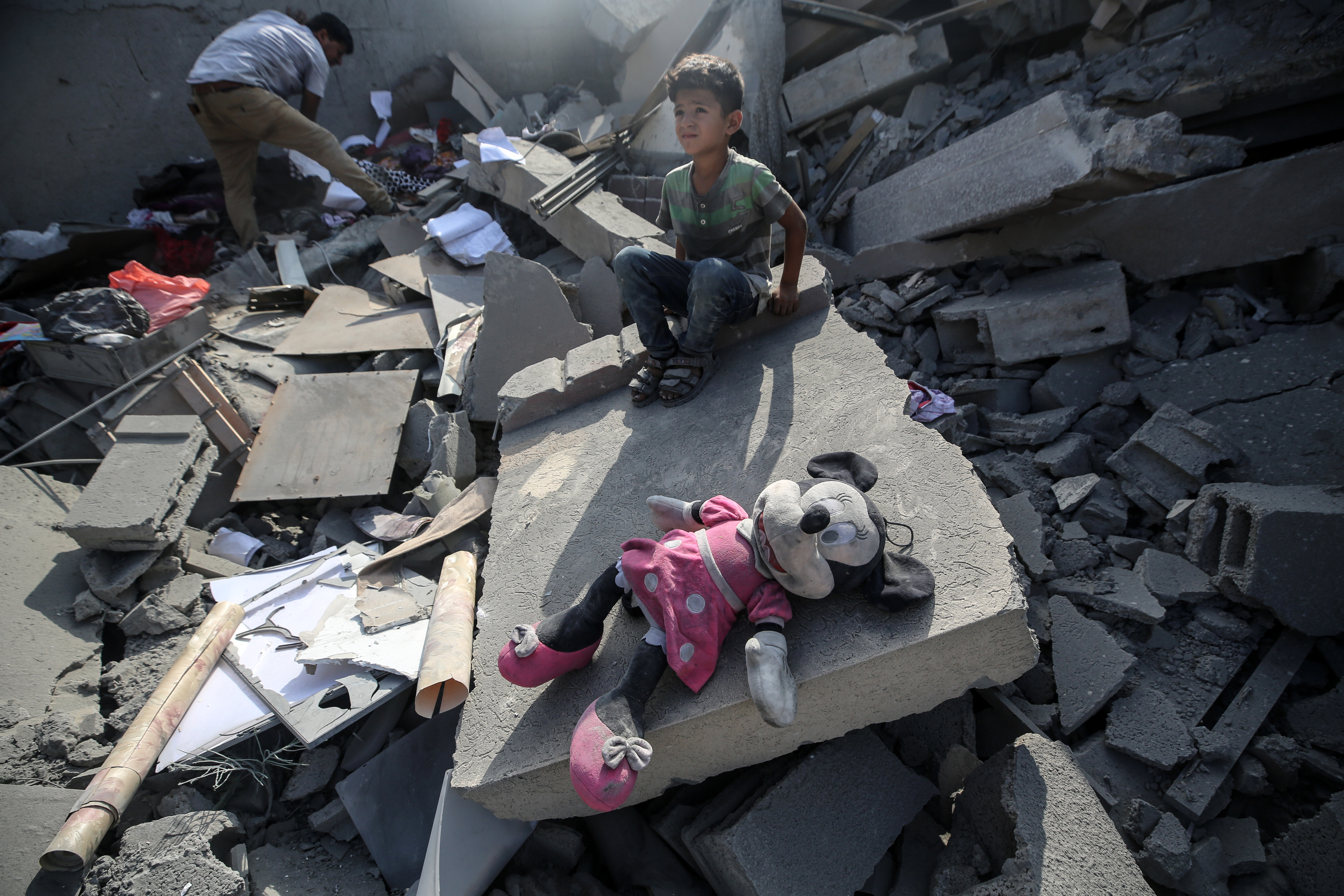 A Palestinian family in the aftermath of an Israeli strike in the Nuseirat refugee camp in the central Gaza Strip. Photo / Getty Images