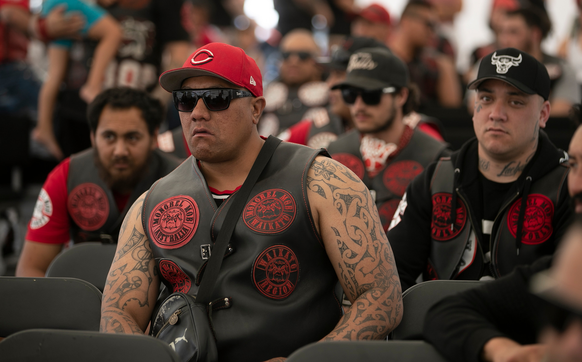 Members of the Waikato Mongrel Mob Kingdom Chapter listen to various speakers. Photo / Alan Gibson