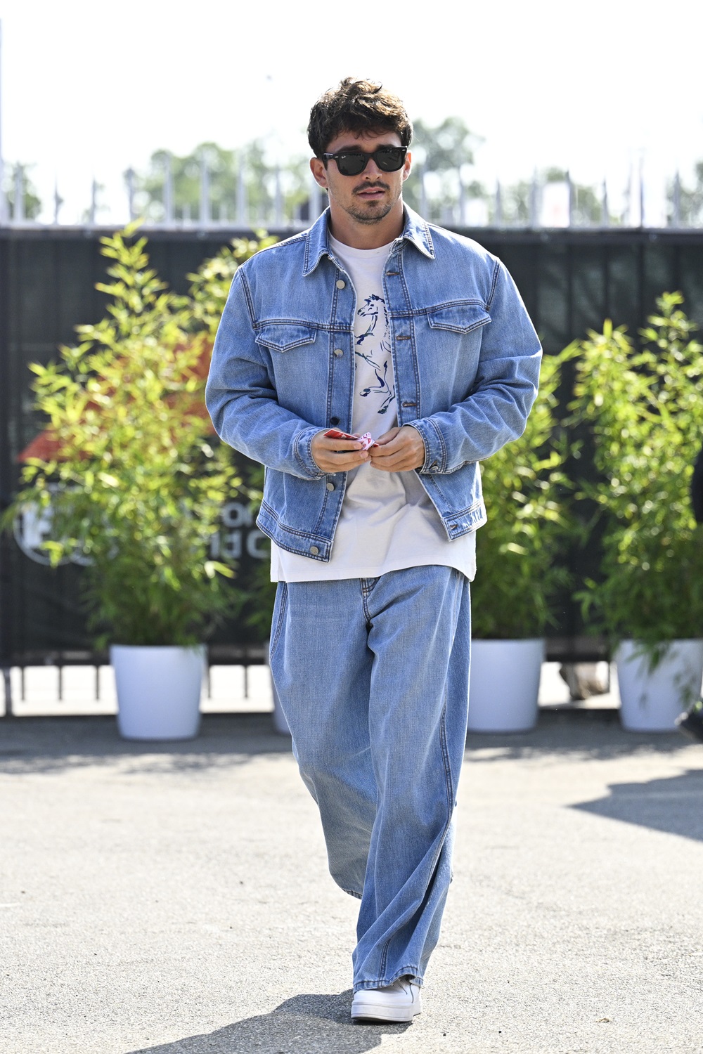 Charles Leclerc wearing a denim set during the F1 Gran prix of Italy in August. Photo / Getty Images