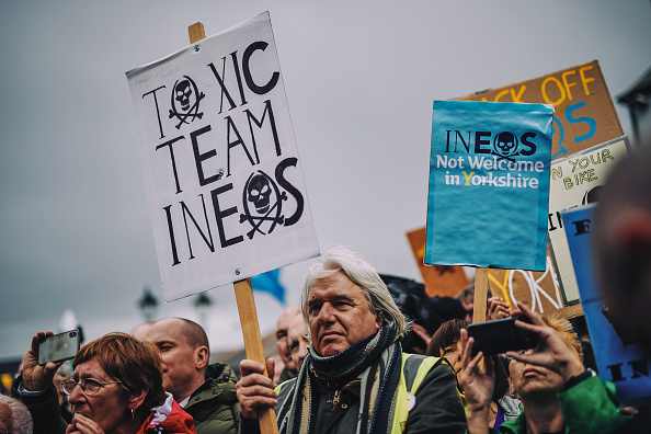 Demonstrators hold anti-fracking placards in the UK. Photo / Getty