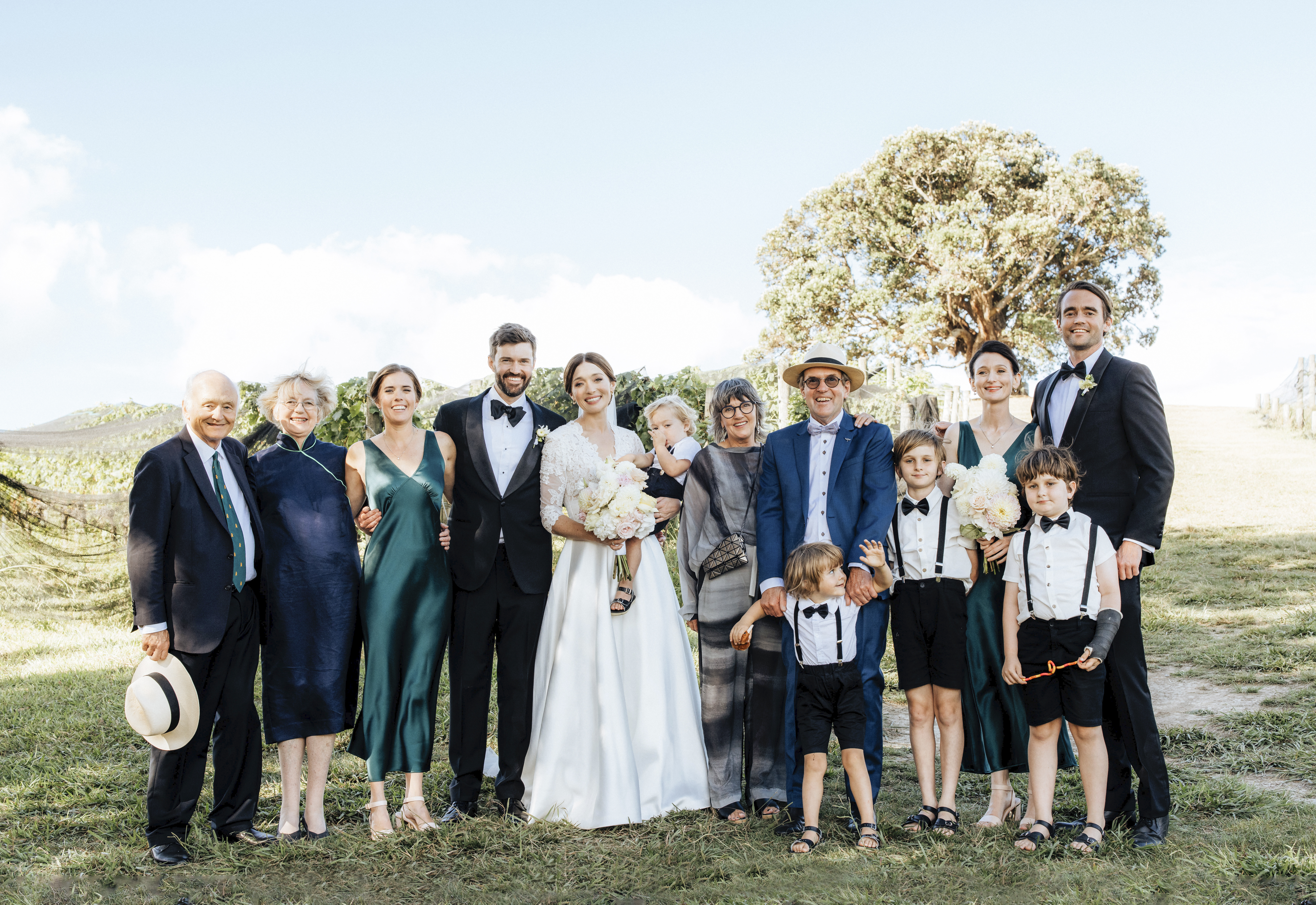 The couple and their guests took a quick group photo before heading to the party. Photo / Wildfolk Photography