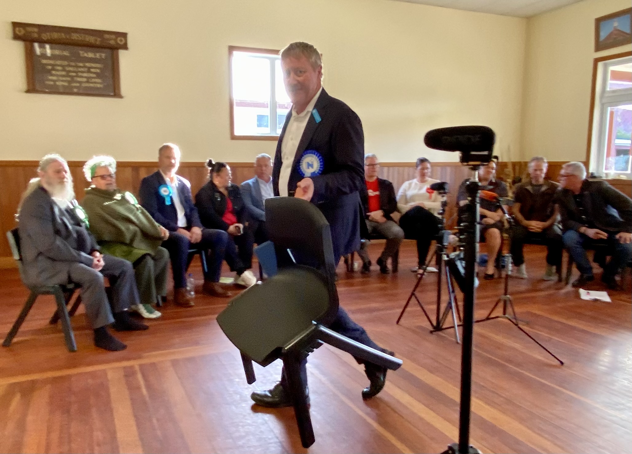 National's Grant McCallum joins the semi-circle of candidates at Otiria Marae's election debate in Moerewa. Photo / David Fisher