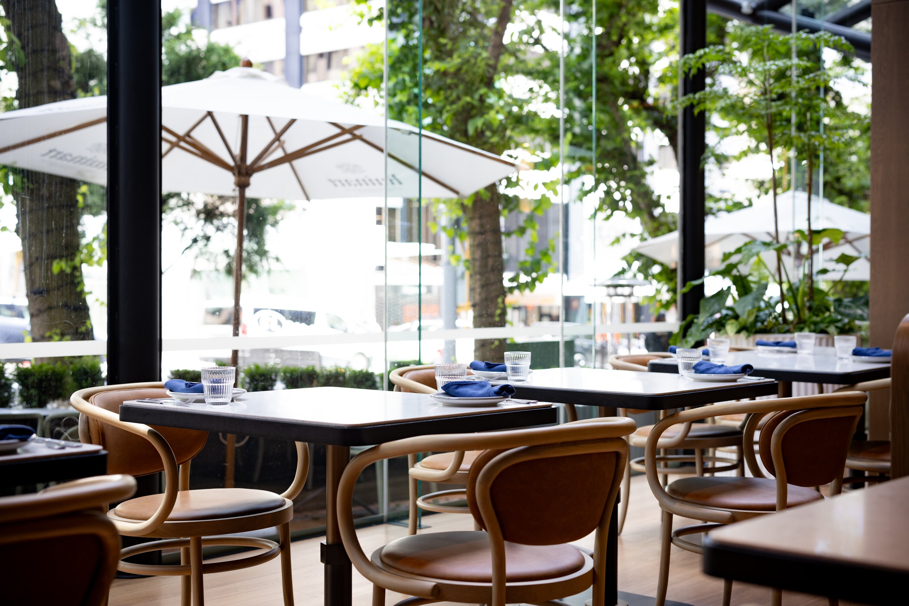 The dining room features floor-to-ceiling windows. Photo / Babiche Martens