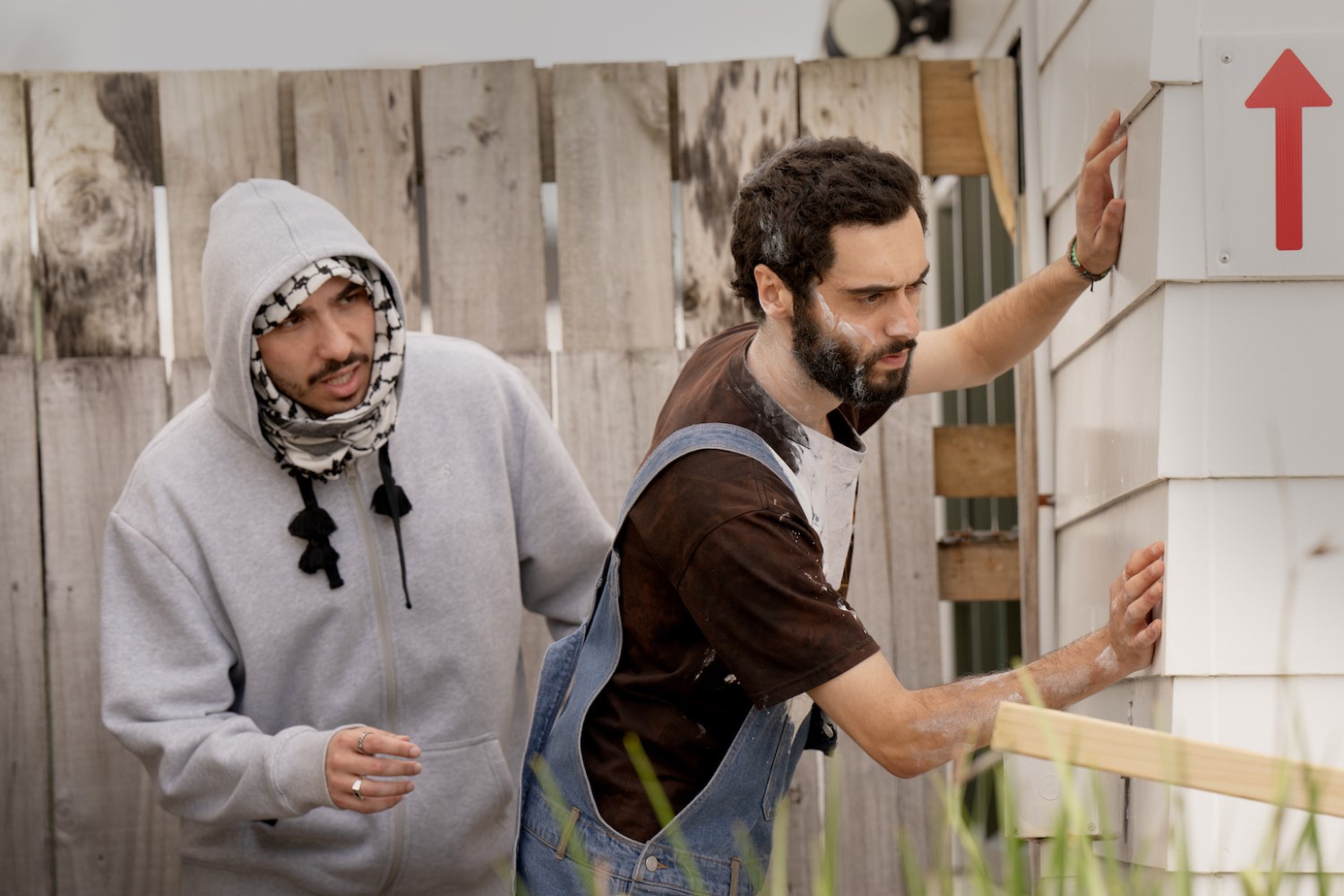 The show's cast of characters, including Ahmad and Said, grapple with surveillance and confusion.