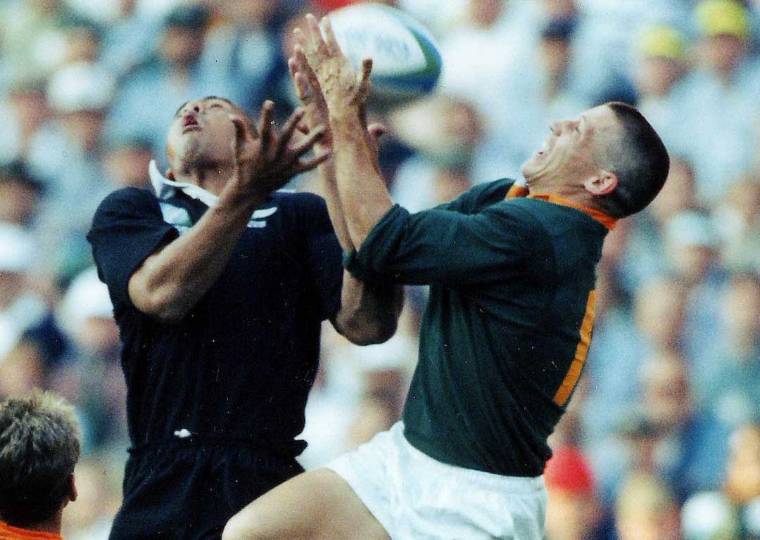 James Small contests with Jonah Lomu in the air during the Rugby World Cup final. Photosport