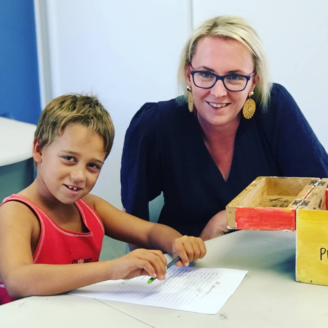 Mel Singh helping a LeaderLife youngster write a letter as part of a project to teach and improve connection and literacy. Photo / LeaderLife