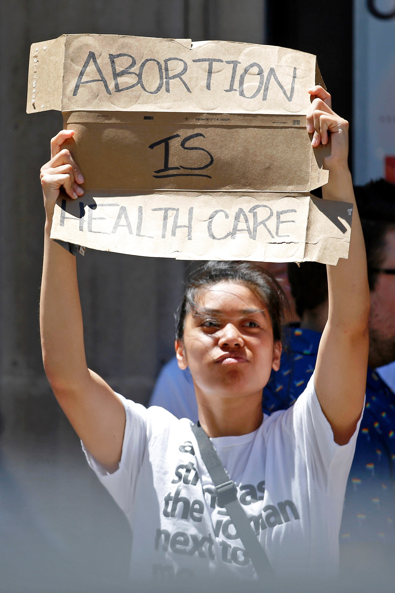 A spectator holds a sign that says Abortion is health care during the 51st Chicago Pride Parade in Chicago on Sunday. Photo / AP