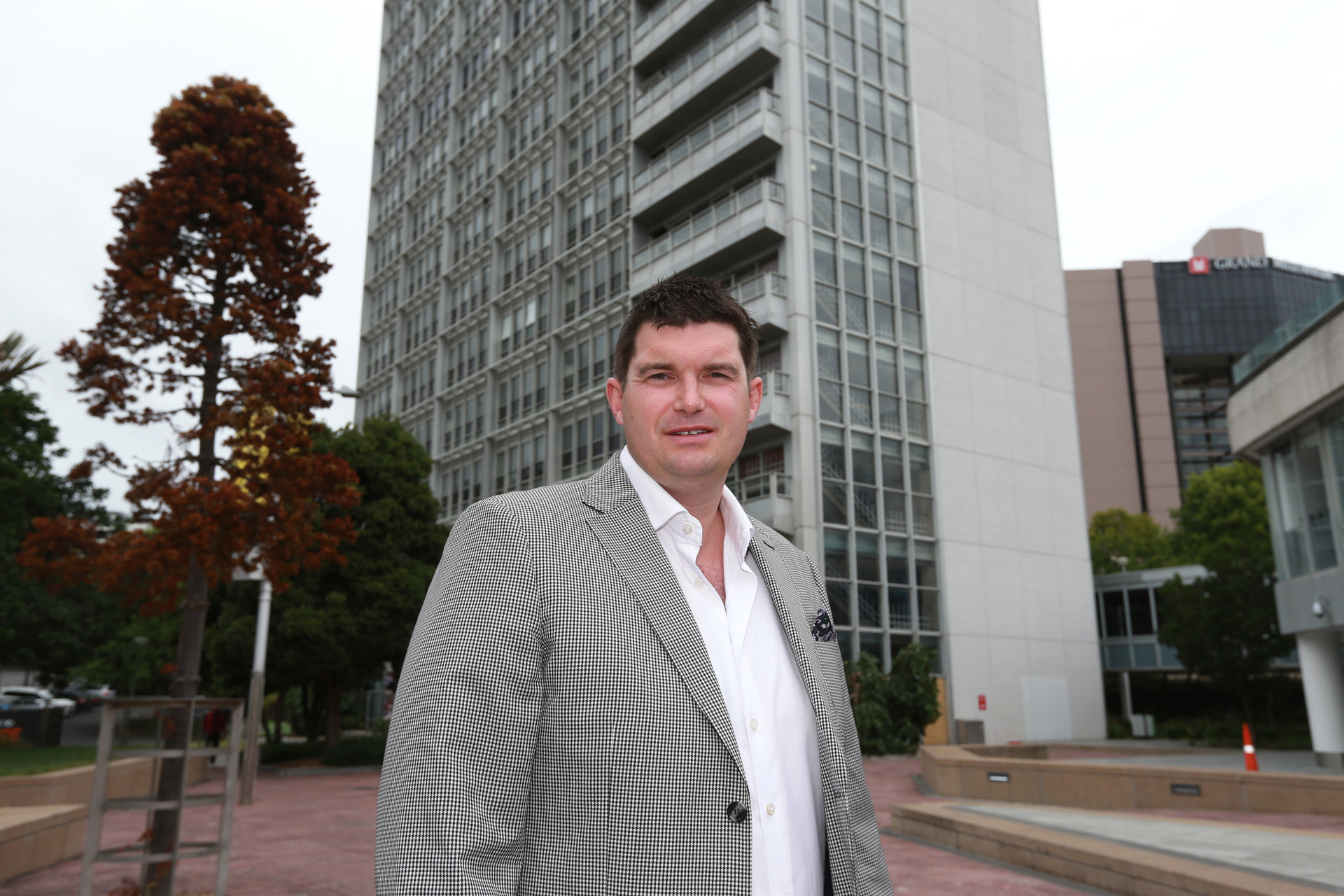 Developer John Love in front of the Civic Administration Building in Aotea Square which he is turning into apartments. Photo / Doug Sherring