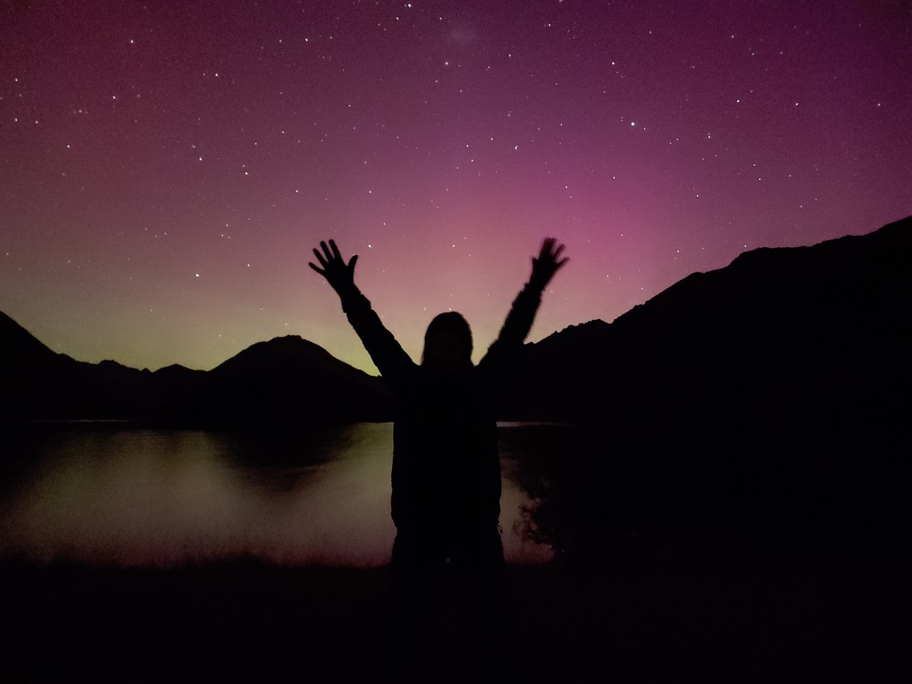 Jodi Hoare celebrating her first time capturing the Southern Lights in Queenstown near Lake Moke. Photo / Jodie  Hoare