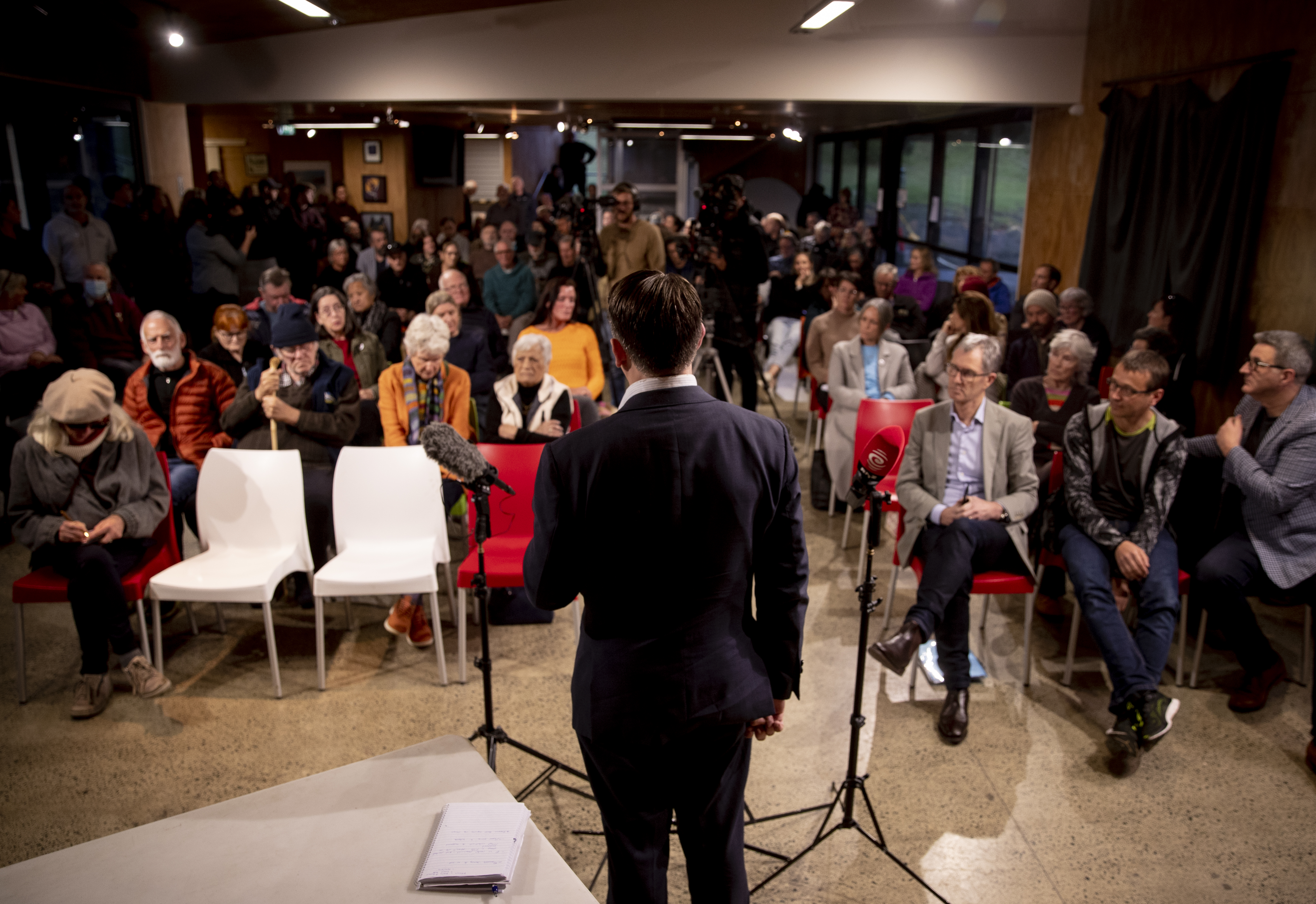 Minister for Auckland Michael Wood addresses the Muriwai meeting on June 15. The 