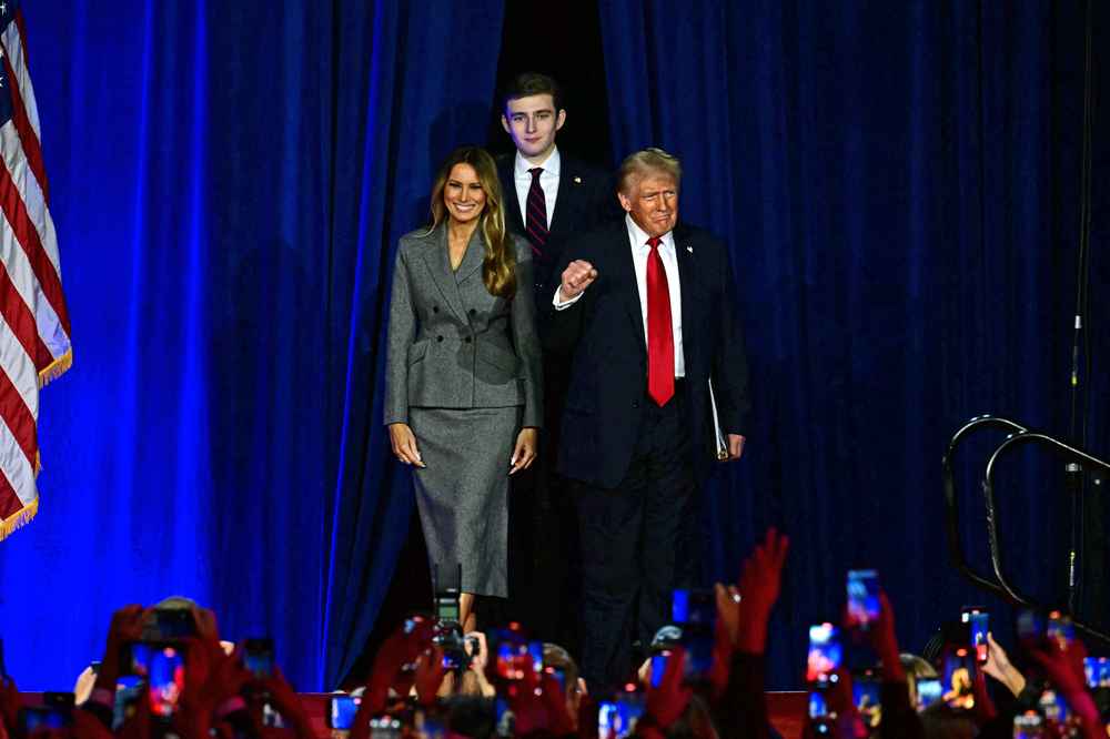Donald Trump arriving alongside former US First Lady Melania Trump and his son Barron Trump at the West Palm Beach Convention Center in Florida. Photo / AFP