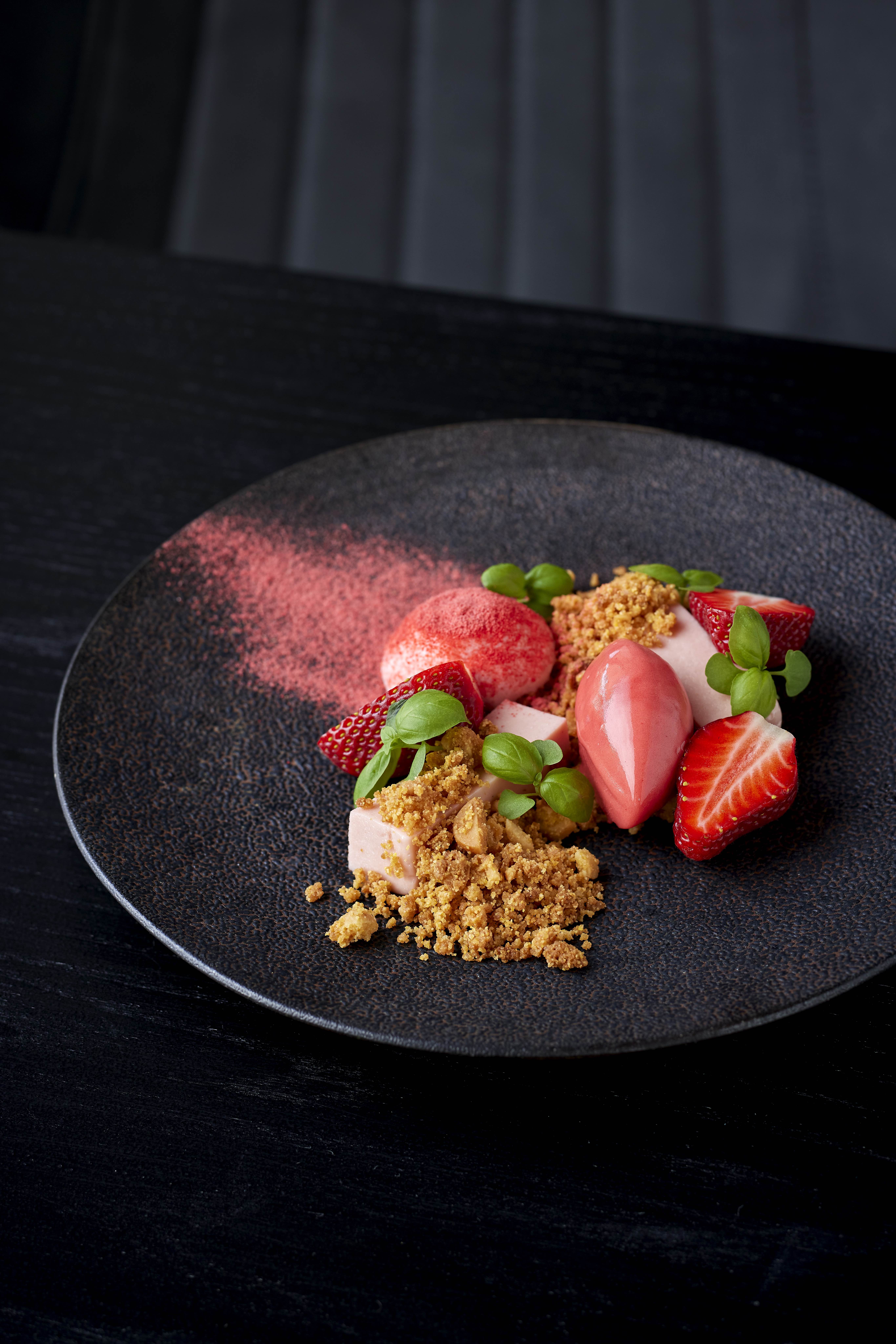 Kumeū strawberry and Cambridge cream panna cotta with strawberry sorbet and macadamia crumble. Photo / Babiche Martens