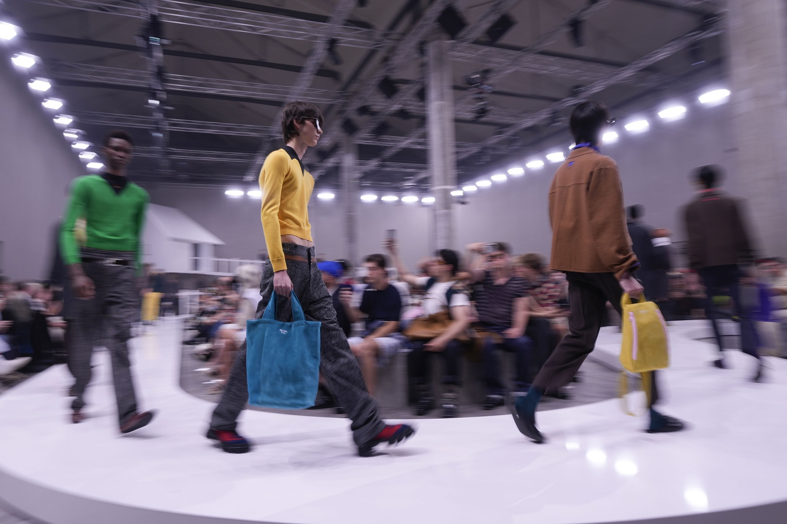 Models walk the runway at the Prada spring-summer 2025 collection in Milan. Photo / AP