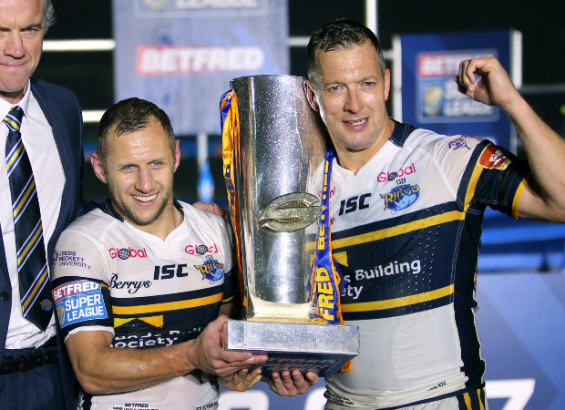 Rob Burrow (left) celebrates winning the English Super League title with teammate Danny McGuire in 2017. Photo / Getty