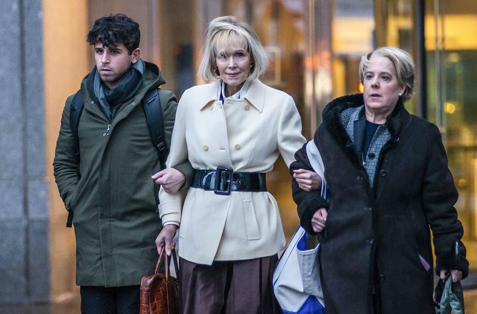 E Jean Carroll (centre) exits federal court in New York with her attorney Roberta Kaplan (right). Photo / AP