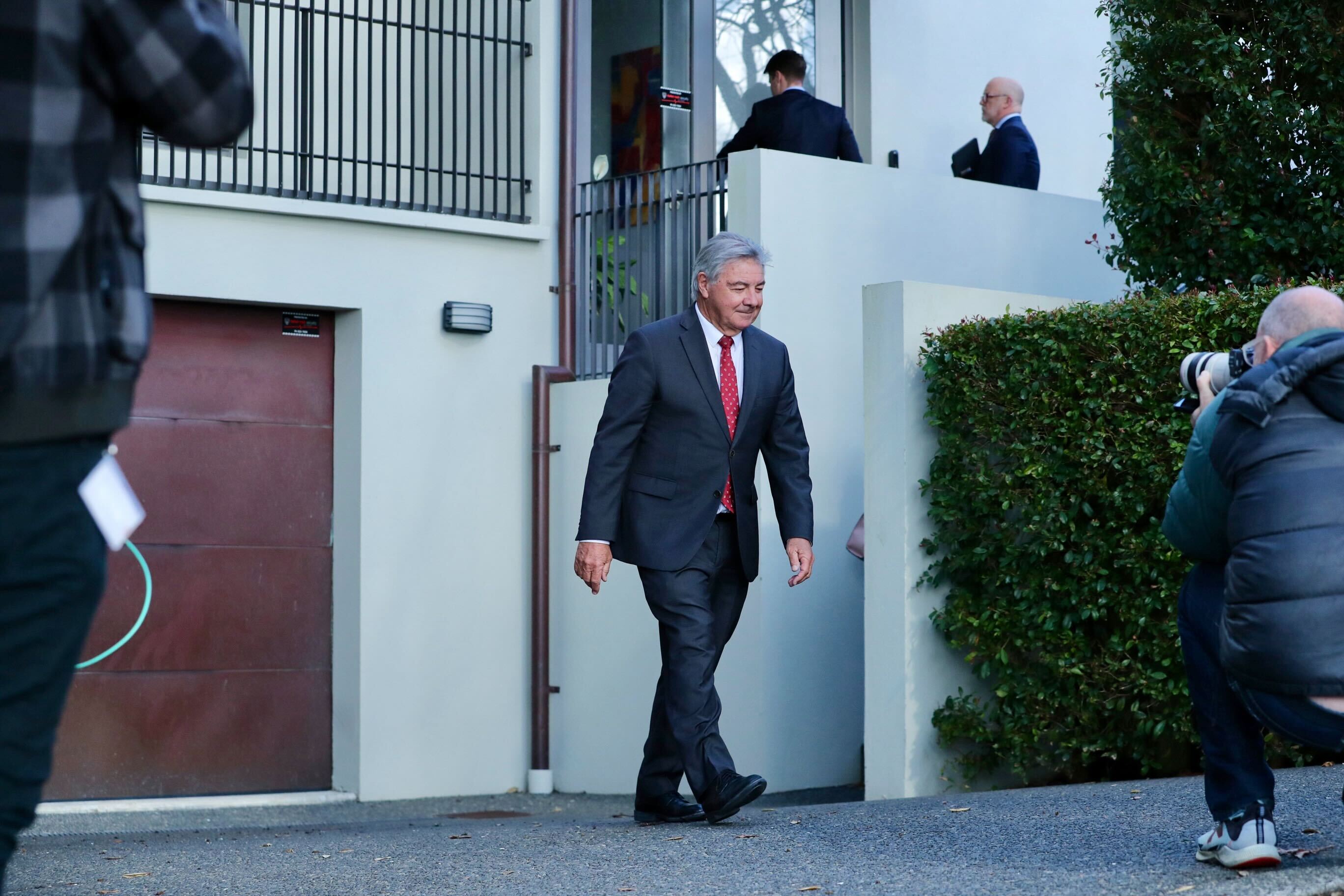 Justice Graham Lang leaves Philip Polkinghorne's Remuera home after a rare site visit by jurors in the Auckland eye surgeon's murder trial. Polkinghorne is accused of strangling wife Pauline Hanna inside the home. Photo / Jason Dorday